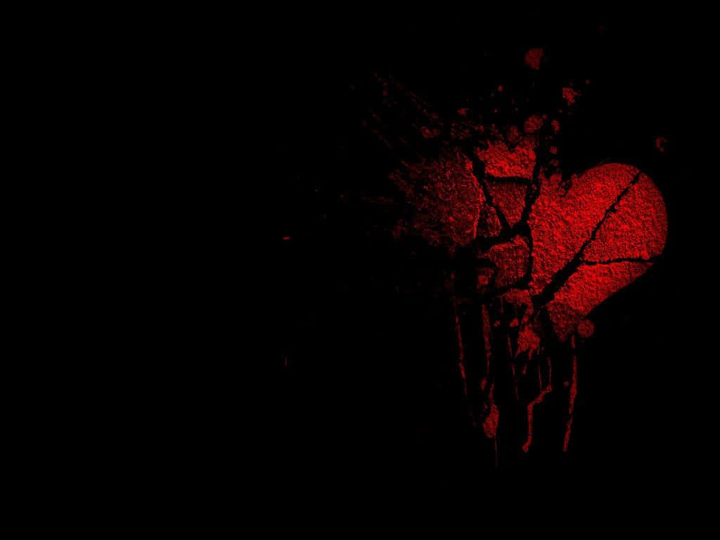 Broken Heart Black 桌布 壁紙 — 一顆破碎的紅色心臟在黑色背景上發光，帶有滴落和飛濺的紋理。