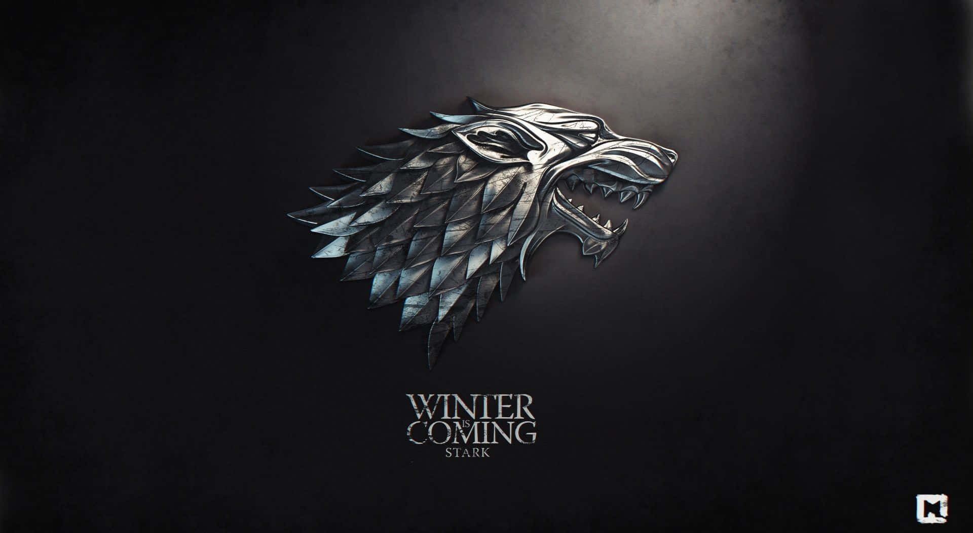 金屬冰原狼頭標誌，帶有'Winter is Coming Stark'文字，深色背景。