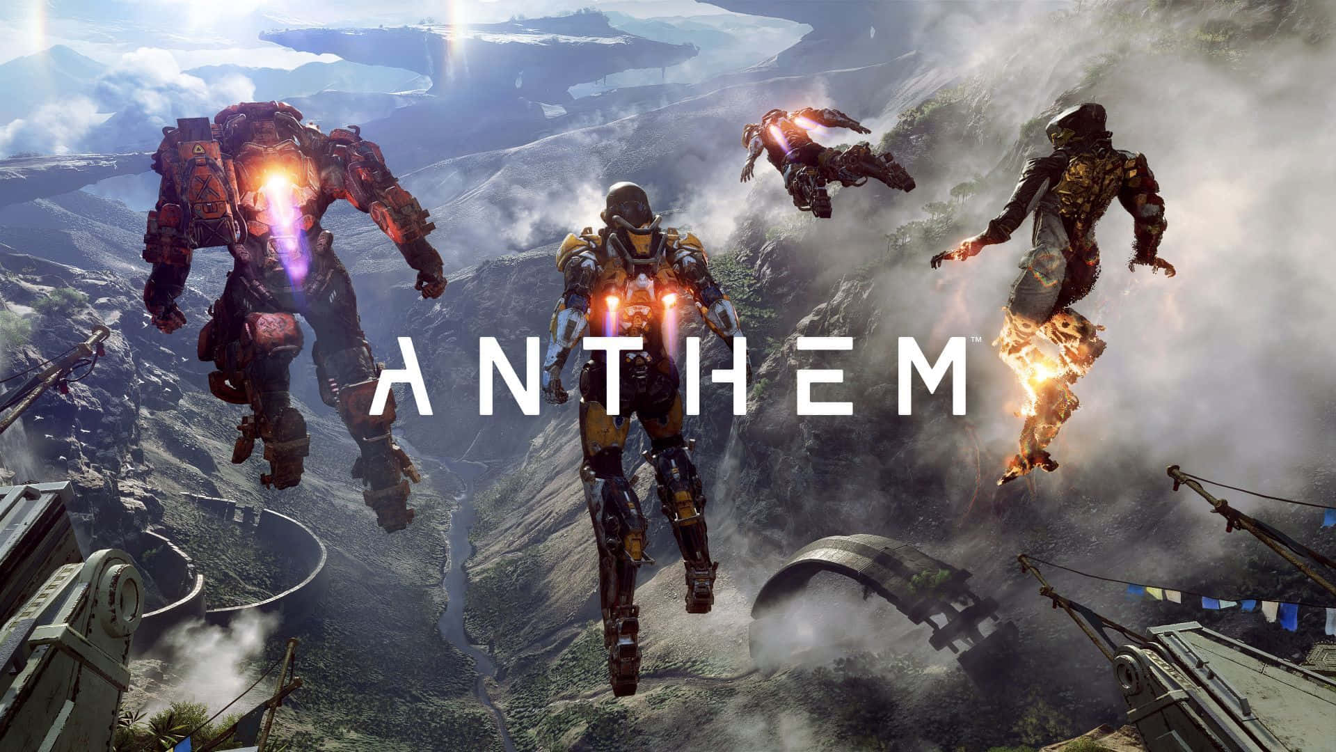 All Games Anthem 壁紙 — 三個裝甲角色在霧氣繚繞的山峰間翱翔，引擎在他們下方發光。