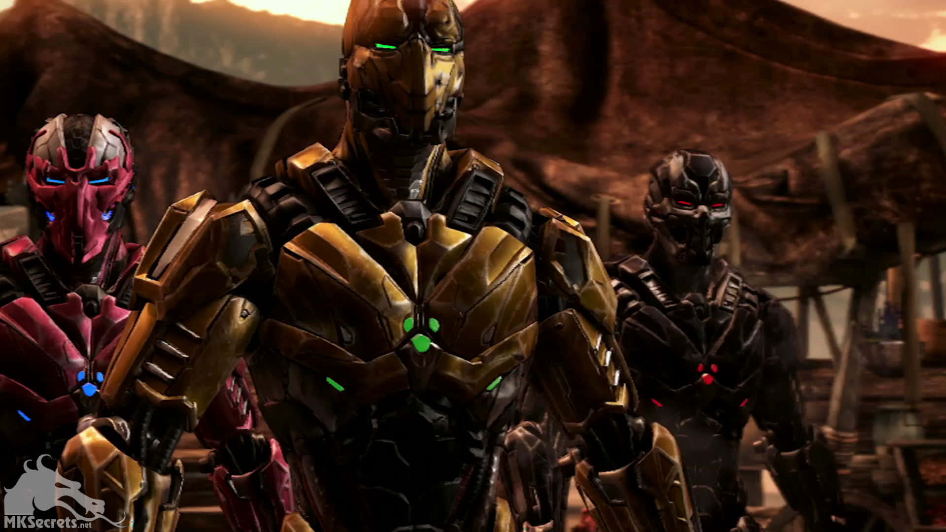 Mortal Kombat Triborg 桌布 壁紙 — 三名裝甲戰士眼睛發光，站在崎嶇的沙漠峽谷中，背景是溫暖的日落天空。