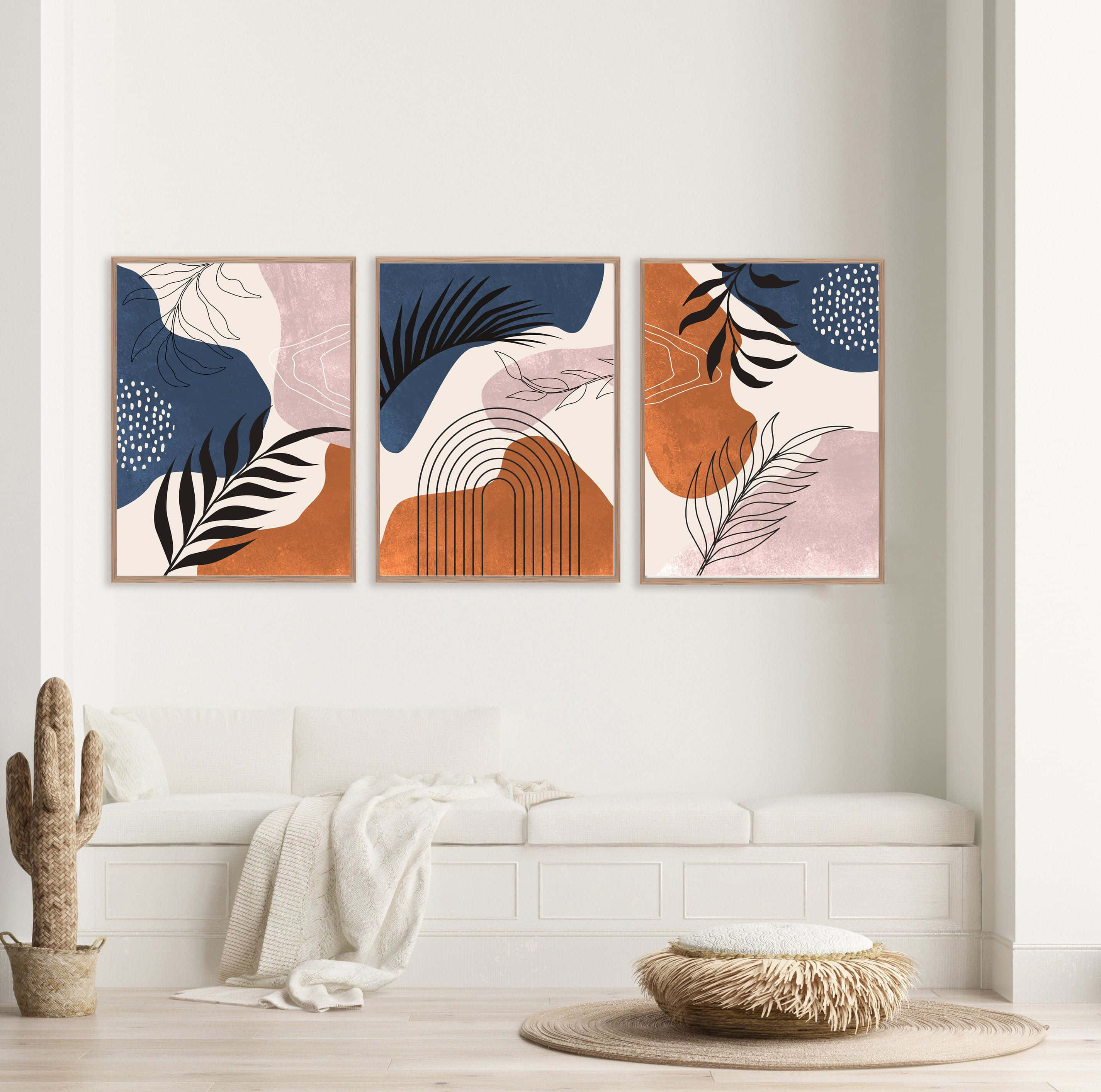Modern Minimalist Art 桌布 壁紙 — 三幅帶有葉子和拱形圖案嘅藍色、橙色同粉紅色抽象藝術作品，掛喺簡約客廳嘅白色梳化上面。