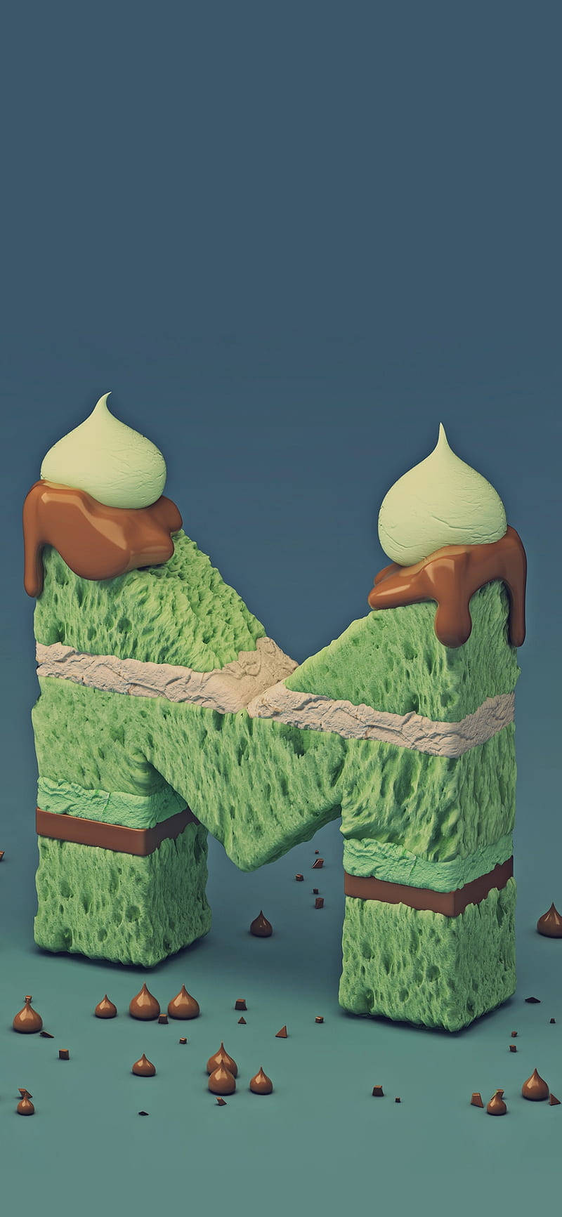 綠色海綿蛋糕形狀的字母N，帶有朱古力淋醬和忌廉漩渦。