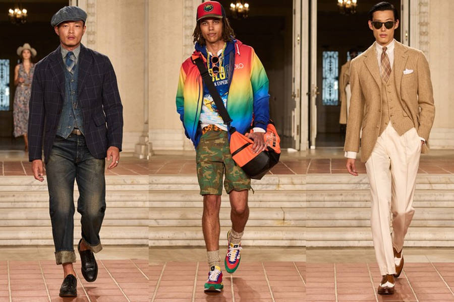 三種 Ralph Lauren 男裝風格 壁紙 — 三位男模特兒自信地走在寬敞的瓷磚天橋上，展示大膽的時尚，包括彩虹外套和訂製西裝，在溫暖的室內燈光下。