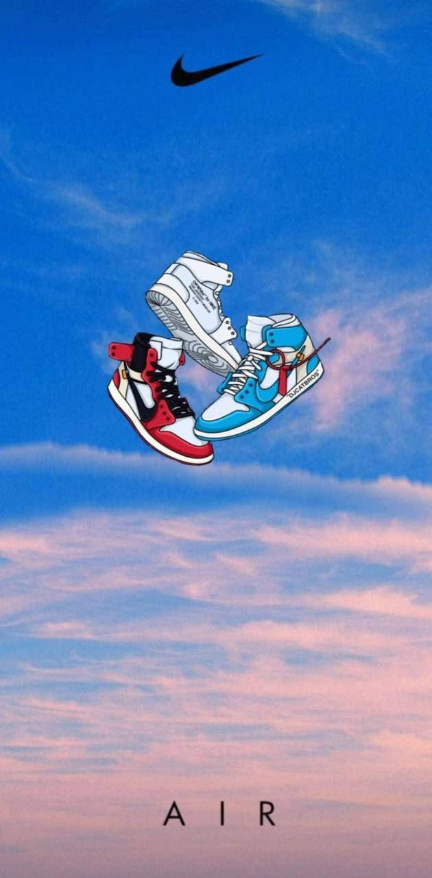 Nike Air Jordan 1 桌布 壁紙 — 三隻風格化的運動鞋漂浮在漸變天空前，帶有Nike勾號和下方的AIR字樣。