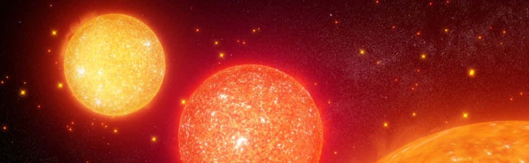 Red Giant 桌布 壁紙 — 三顆發光的太陽在佈滿星星的宇宙背景下，以熾熱的能量脈動。
