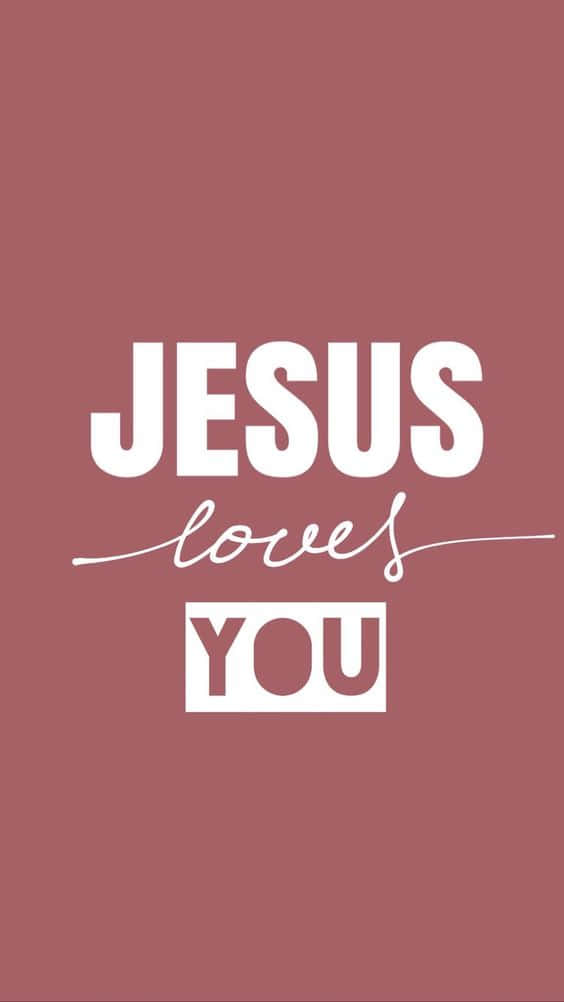 在塵粉玫瑰背景上以白色顯示「JESUS loves YOU」的文字壁紙。