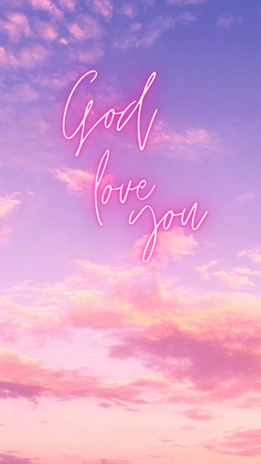 霓虹字體 God love you 映襯著粉彩日落天空。
