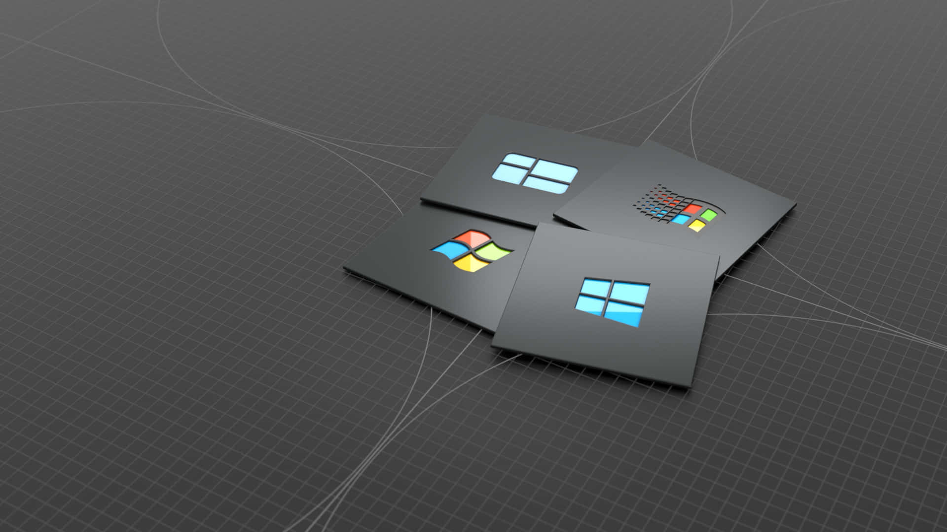 四張帶有 Microsoft Windows 標誌的黑色卡片，背景為深色網格。