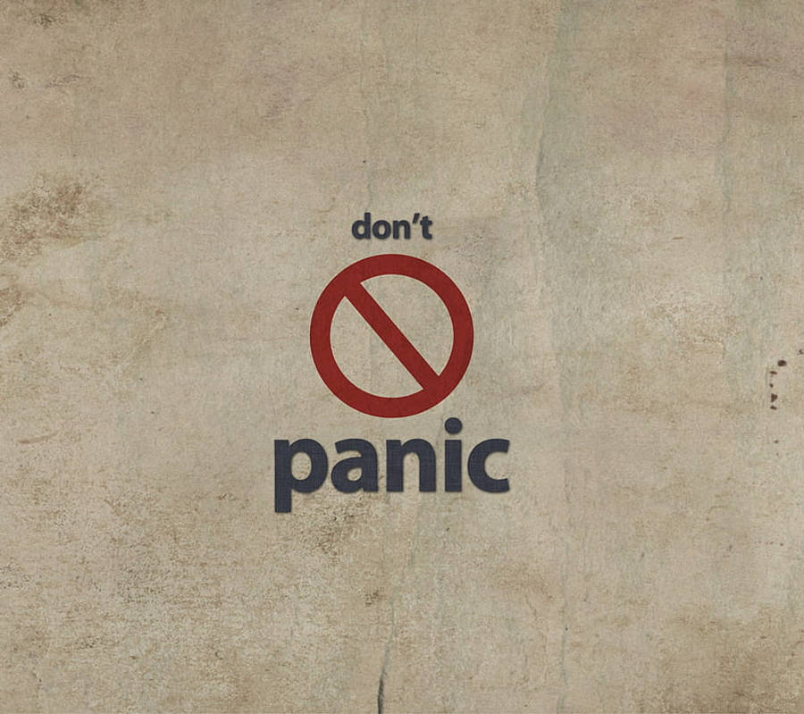 不要驚慌圖示 壁紙 — 一個大膽的紅色禁止符號位於「panic」一詞之上，印在陳舊的米色紙上，上方有「don't」文字。