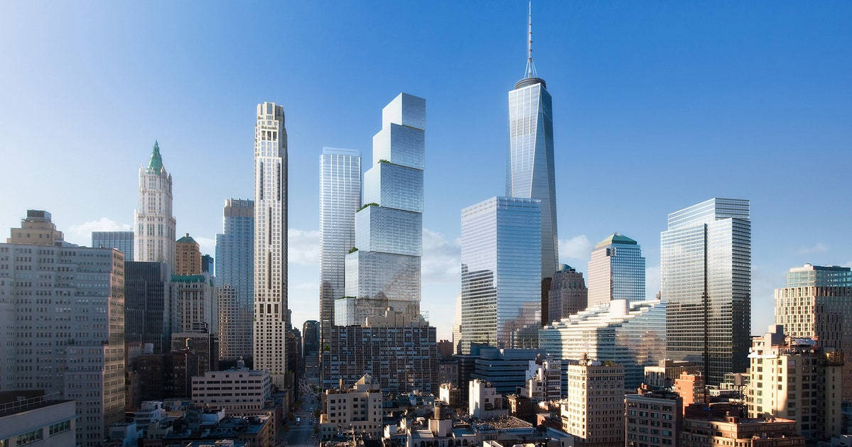 晴朗藍天下，高聳玻璃摩天大樓密集的城市天際線全景。