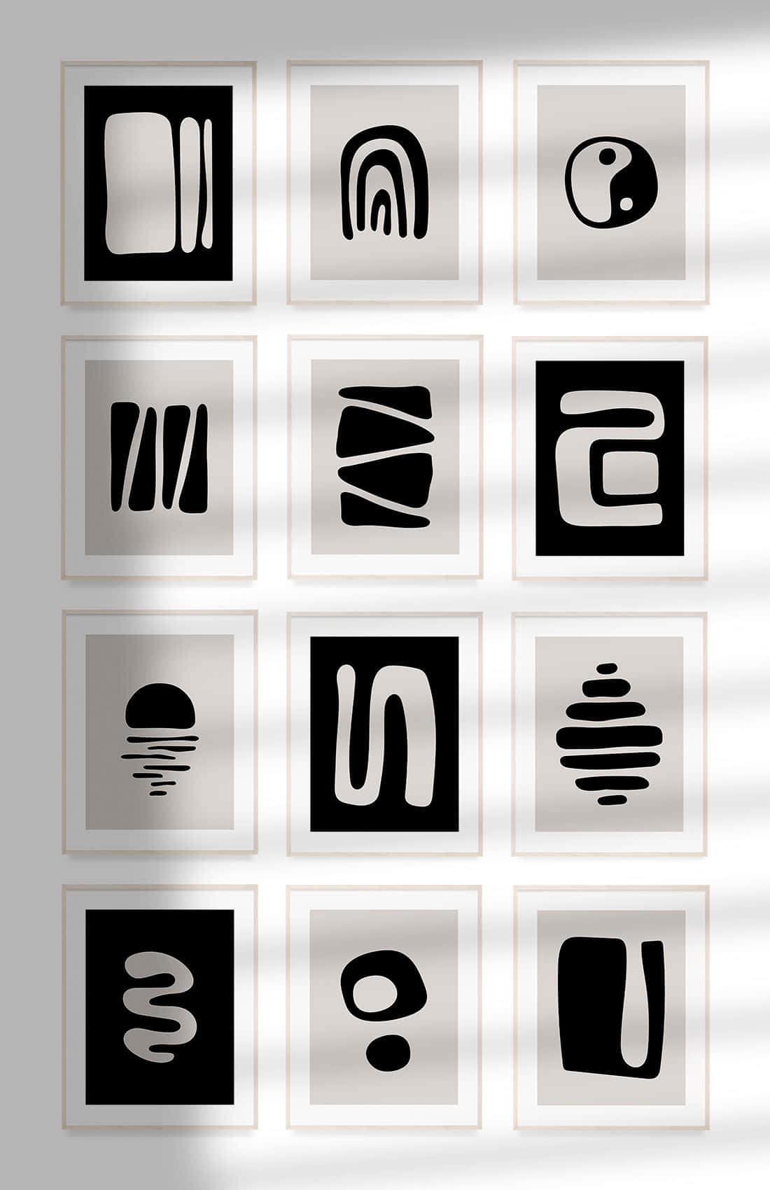 Modern Minimalist Art 桌布 壁紙 — 九幅黑白極簡抽象藝術作品裱框掛在牆上，牆面有柔和光線及自然光圖案。