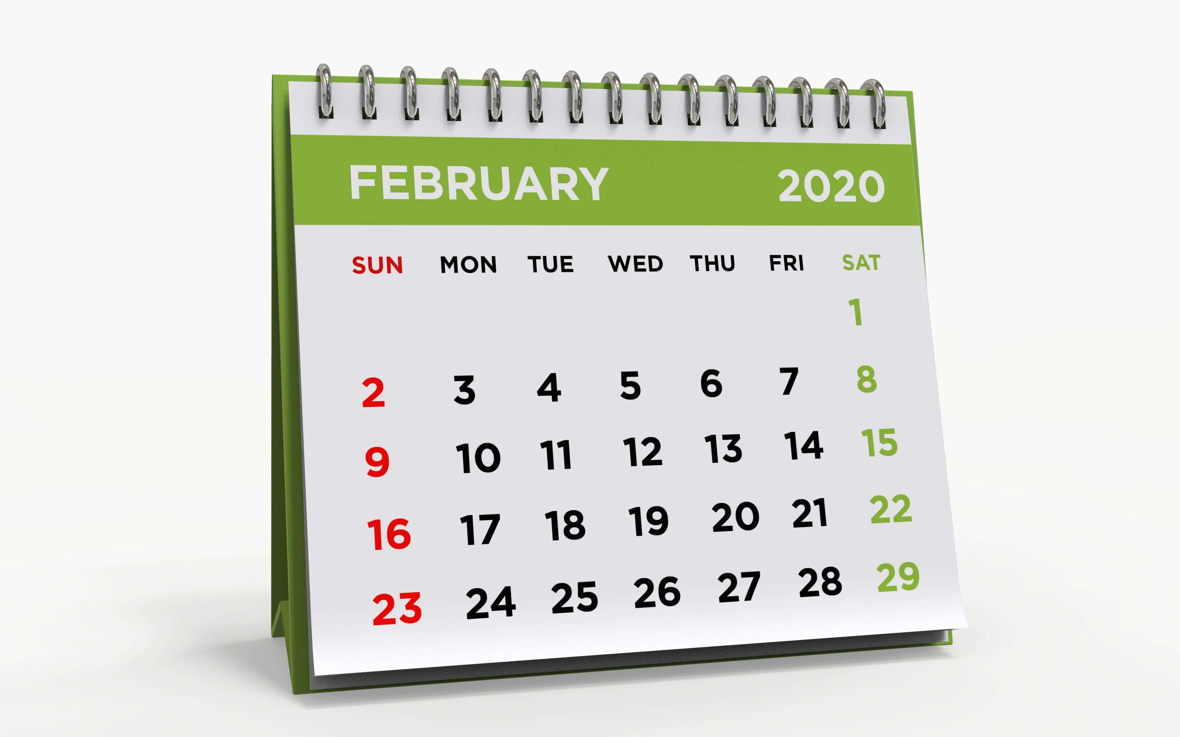 二月迷人冬季風景 壁紙 — 一個綠色螺旋裝訂的桌上日曆，顯示2020年2月，紅色和綠色突出顯示的日期在乾淨的白色背景上。