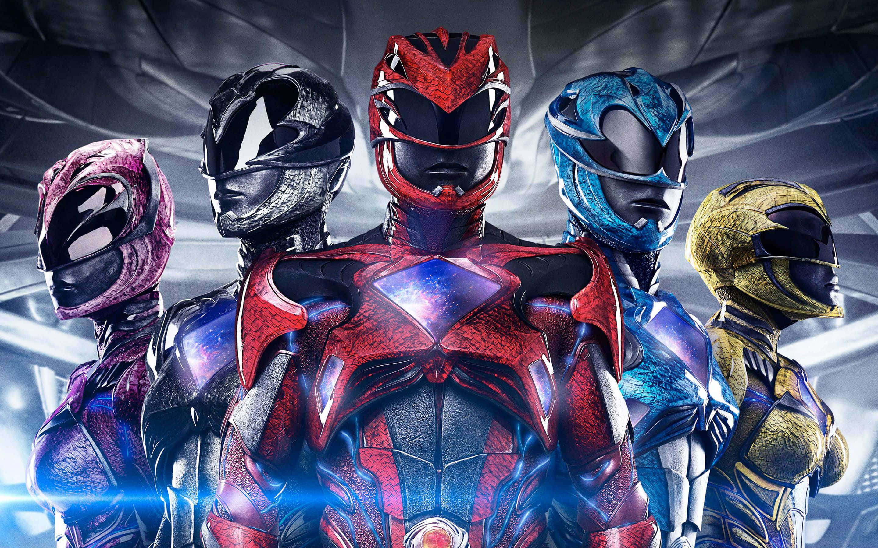 Power Rangers 桌布 壁紙 — 五位身穿彩色裝甲服的恐龍戰隊在帶有藍色光芒的未來金屬背景下英勇站立。