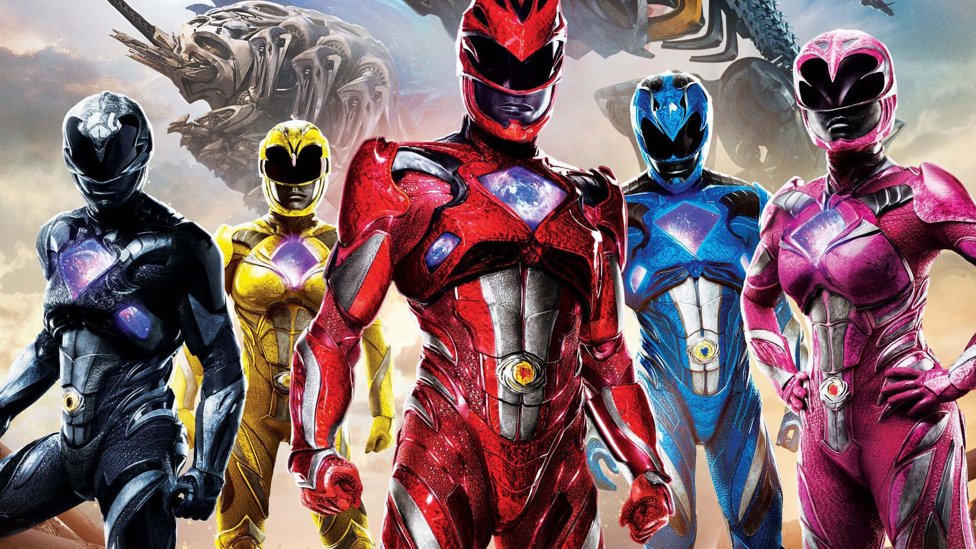 Power Rangers 桌布 壁紙 — 五位身穿紅色、黃色、藍色、粉紅色和黑色戰衣的Power Rangers，在暴風雨的天空下英勇站立，身後有巨大的怪物若隱若現。