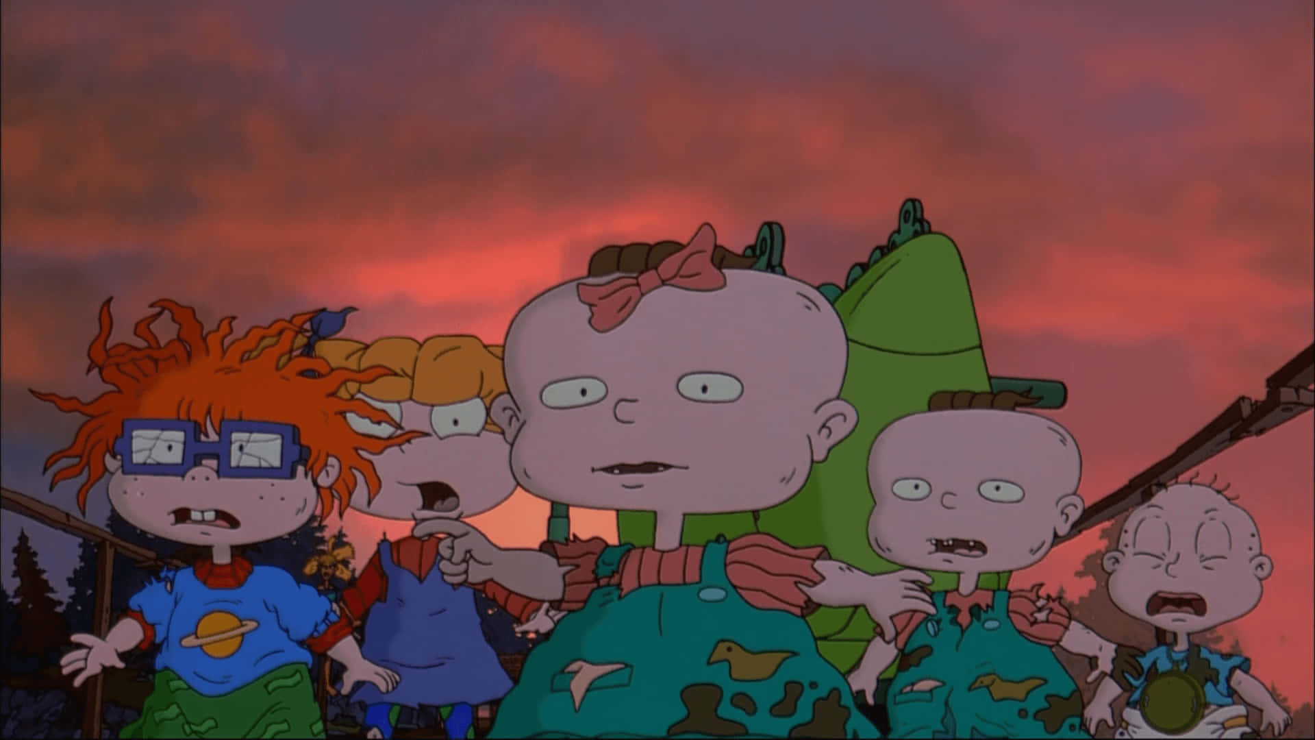 rugrats 桌布 壁紙 — 五個表情誇張的動畫幼兒站在火紅的日落天空前。