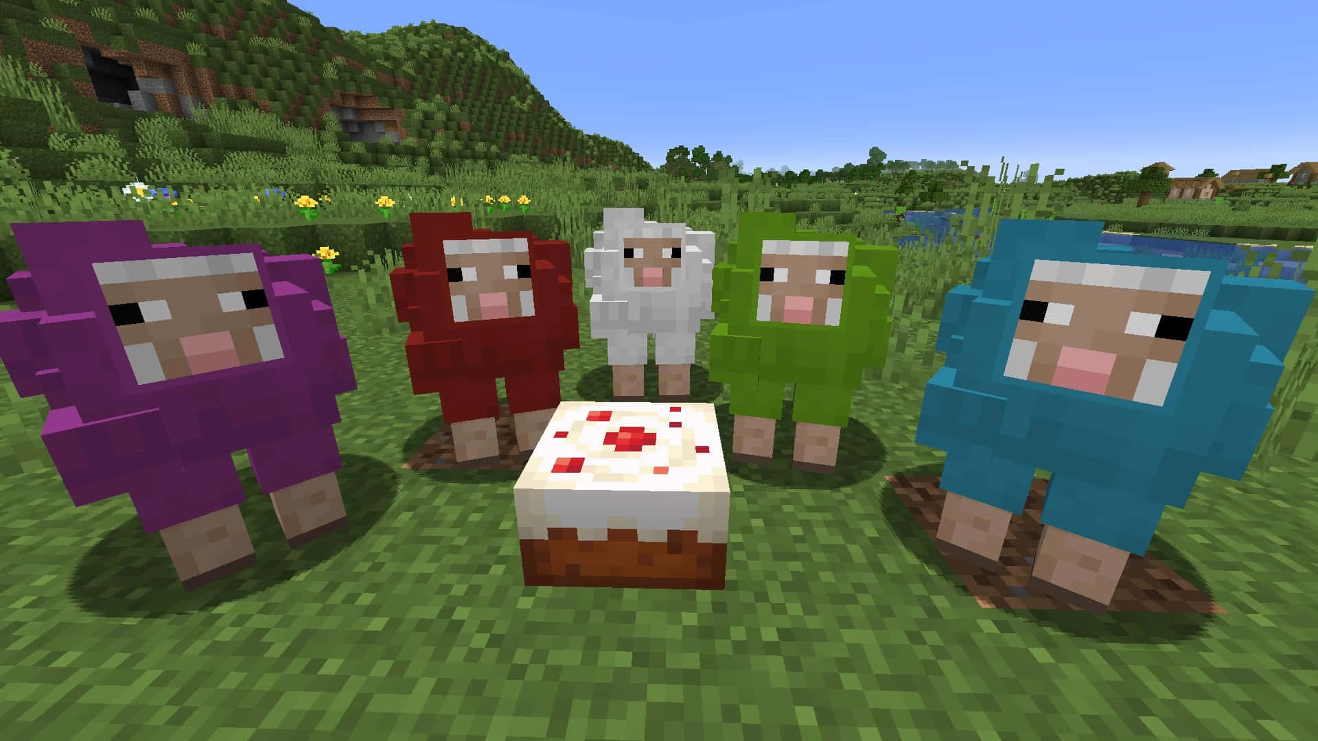 Minecraft Sheep 桌布 壁紙 — 五隻像素化嘅Minecraft羊，身上有彩色羊毛，企喺一個蛋糕周圍，喺一片草地上面，天空晴朗蔚藍。