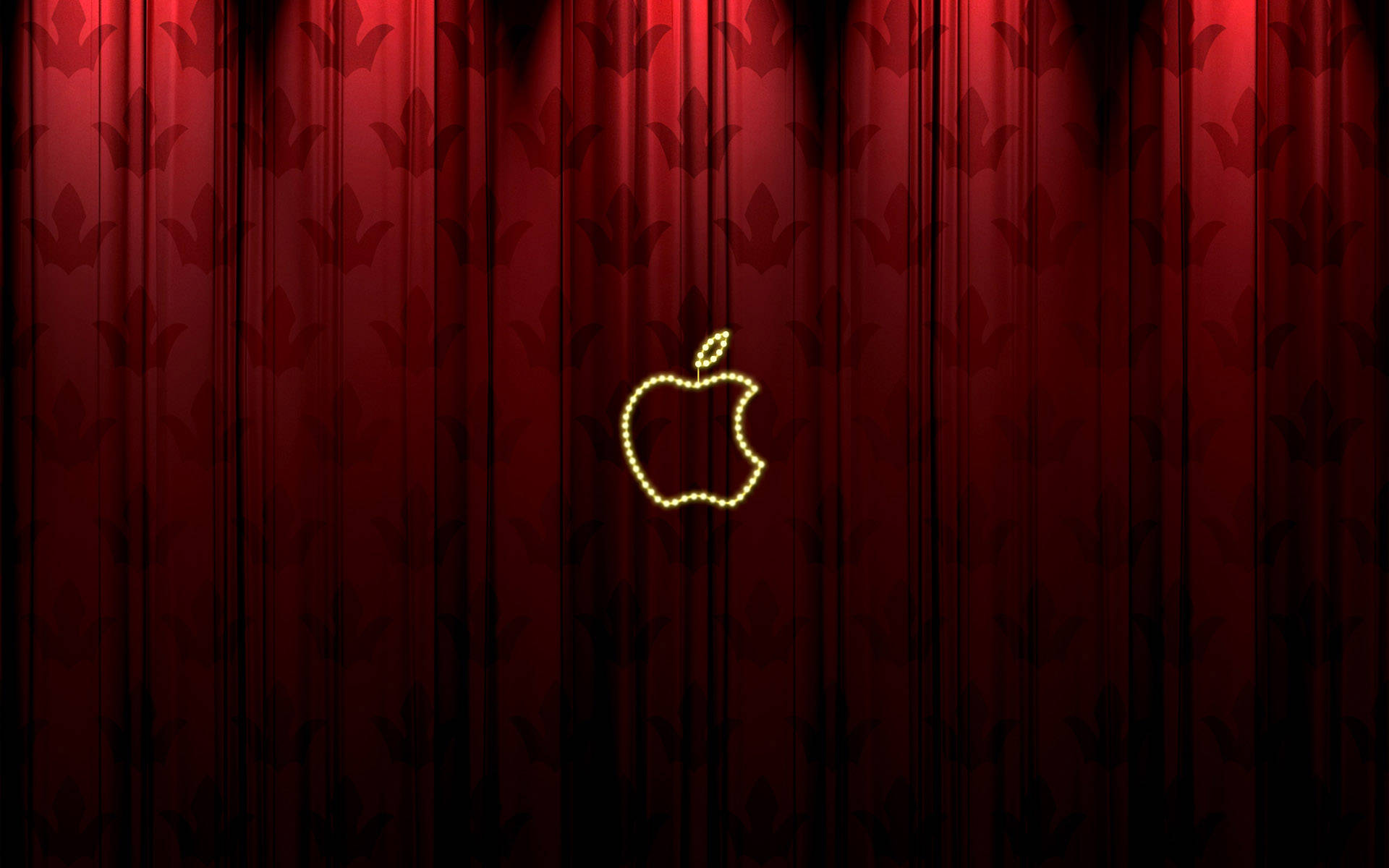紅色圖案窗簾上嘅發光Apple標誌
