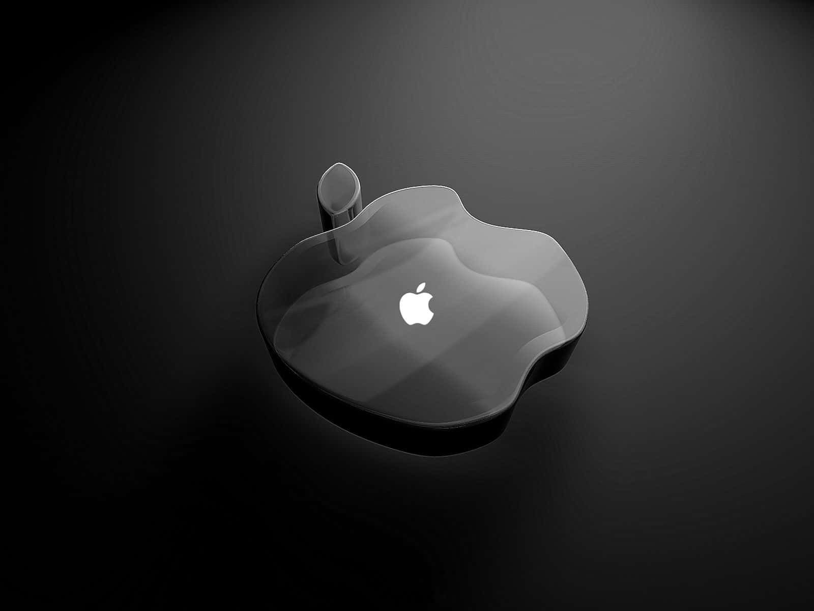 一個透明的玻璃Apple標誌，帶有發光徽章，位於深色背景上。
