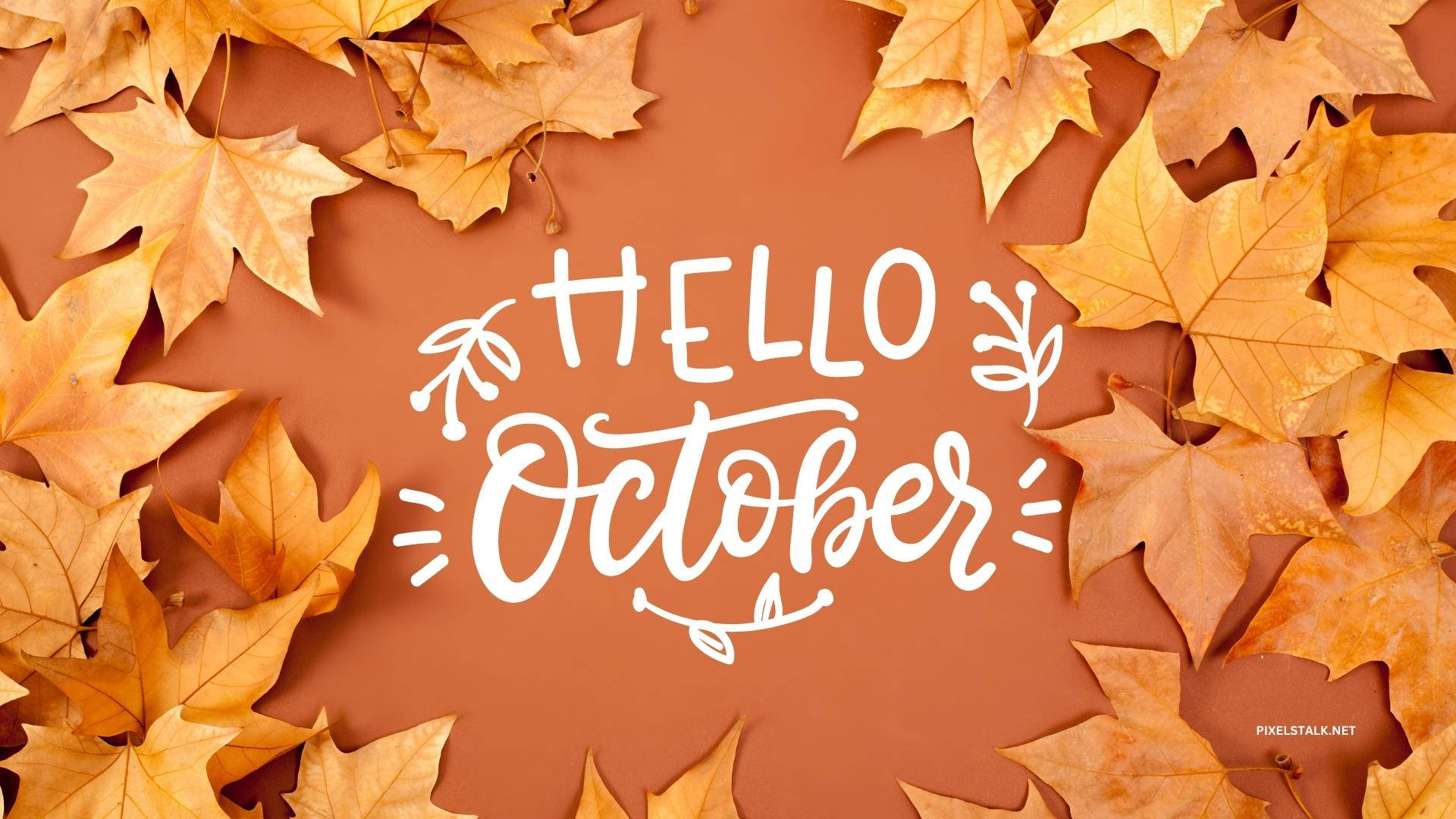 金色秋葉框住一個白色 'Hello October' 問候，背景係陶土色。