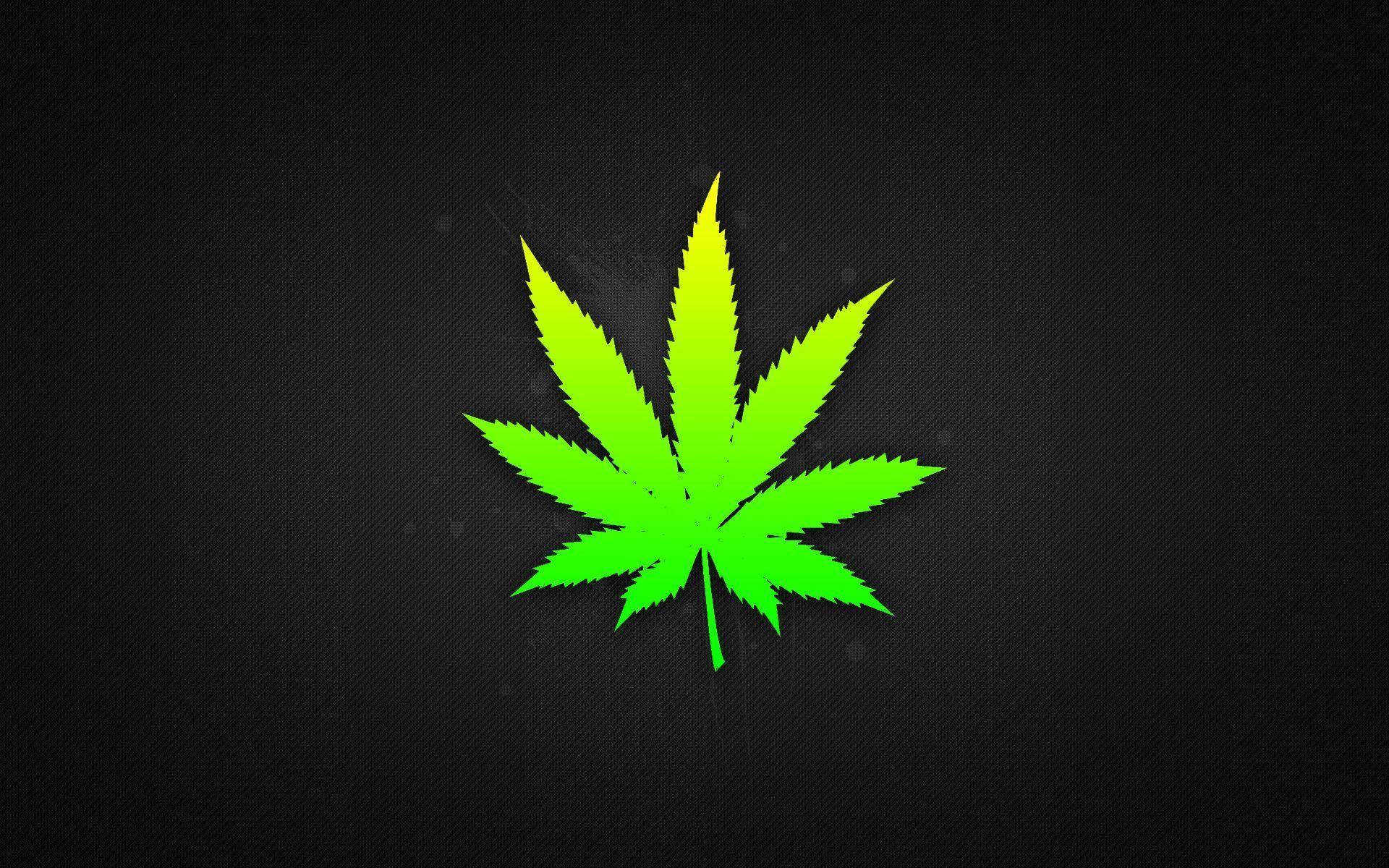 紋理黑色背景上的霓虹綠色大麻葉
