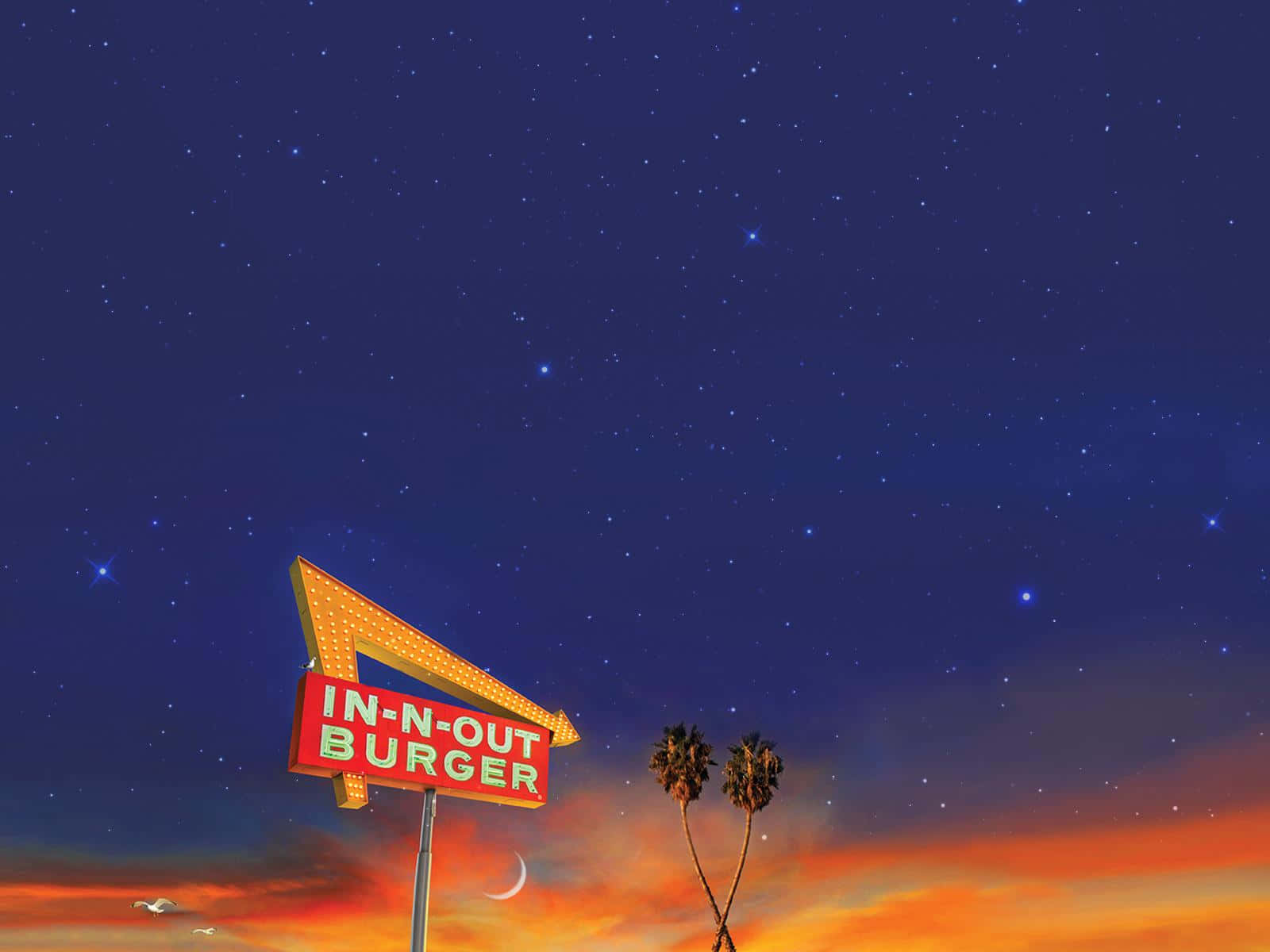 In-N-Out Burger招牌在星空暮色中閃耀，背景有棕櫚樹和新月。