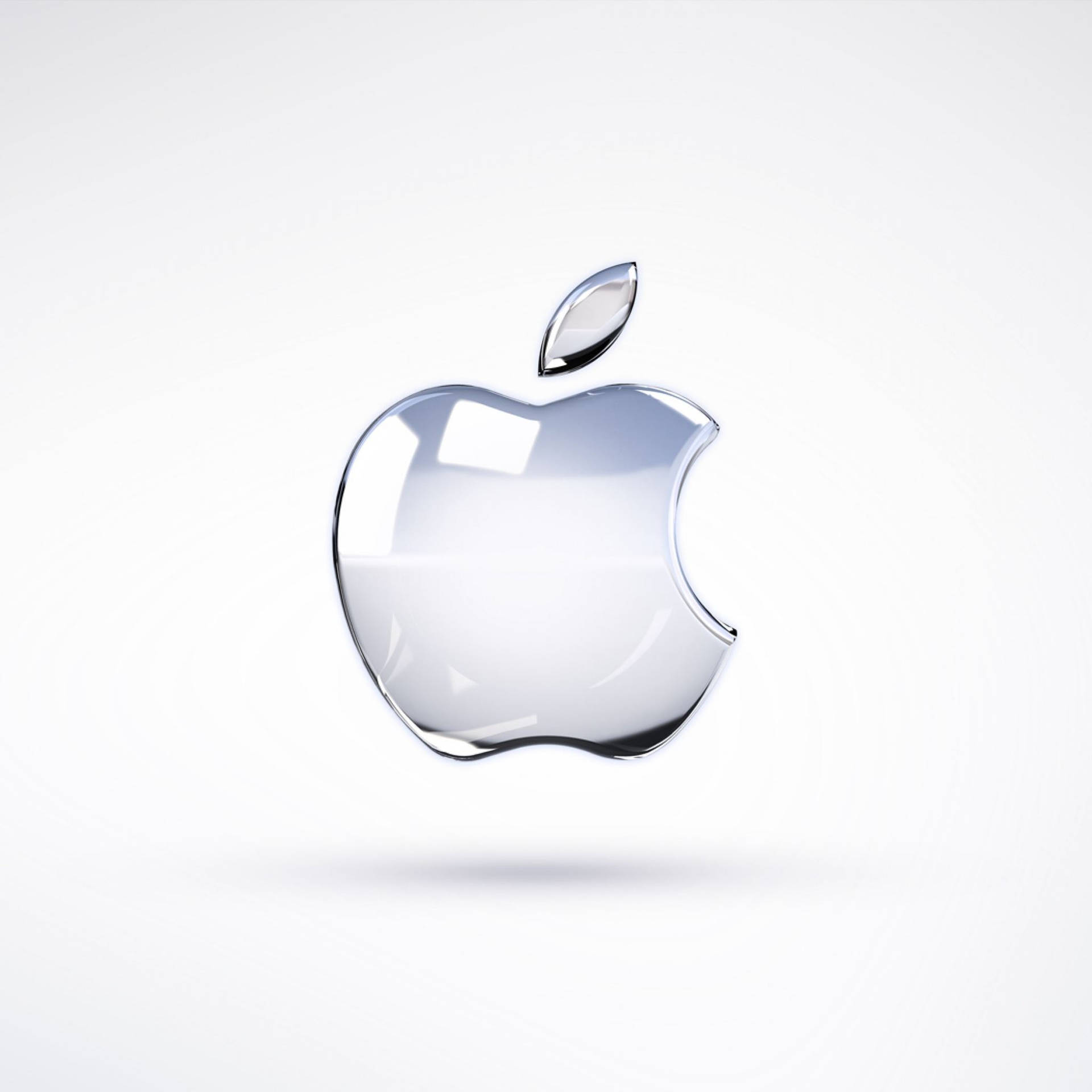 一個帶有金屬葉片的透明玻璃Apple標誌，漂浮在白色背景上。
