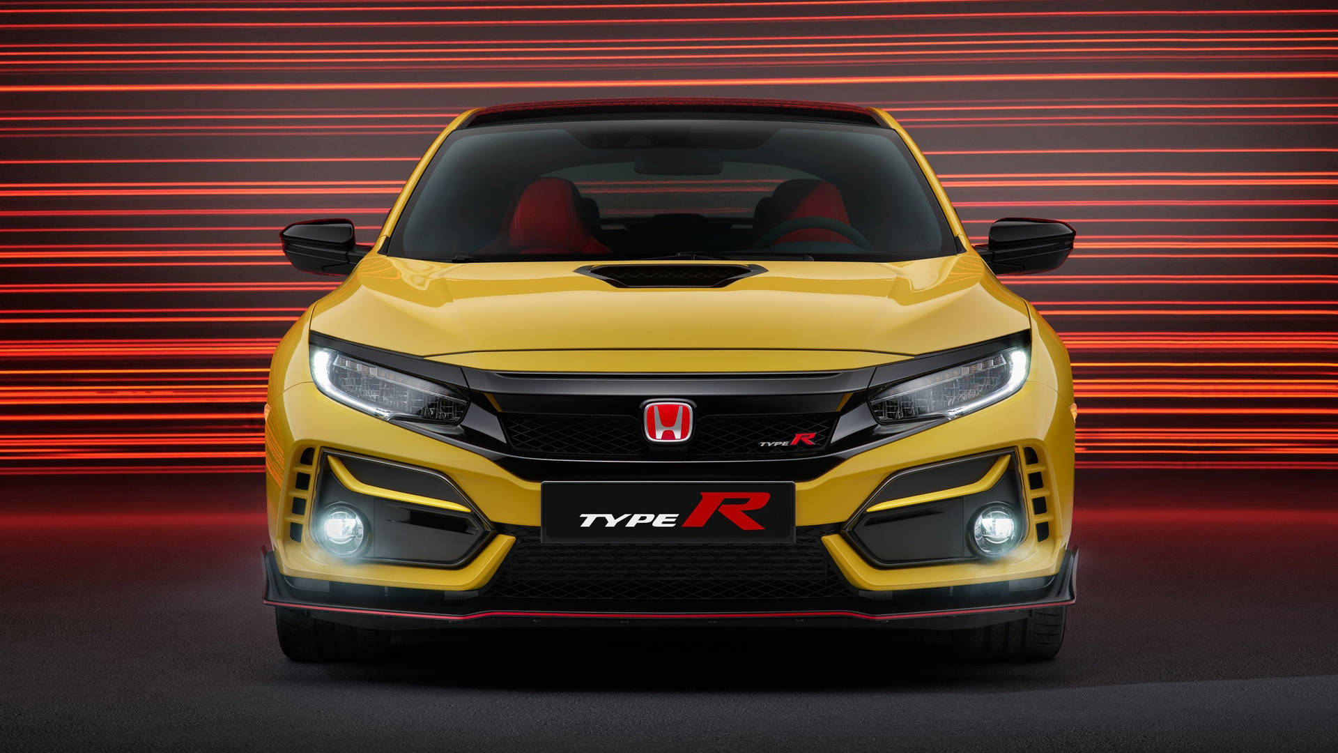黃色本田Civic Type R跑車，帶有紅色點綴和發光車頭燈。