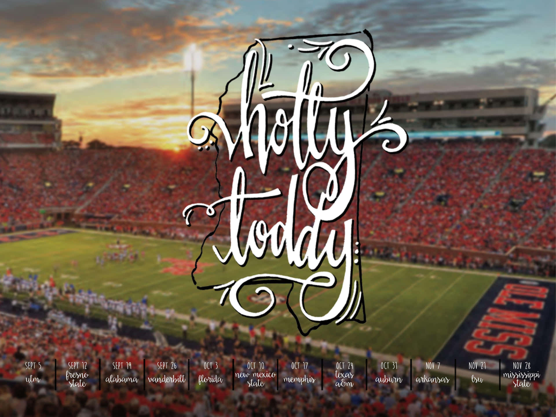 日落時分的足球場，帶有「hotty toddy」文字圖形。