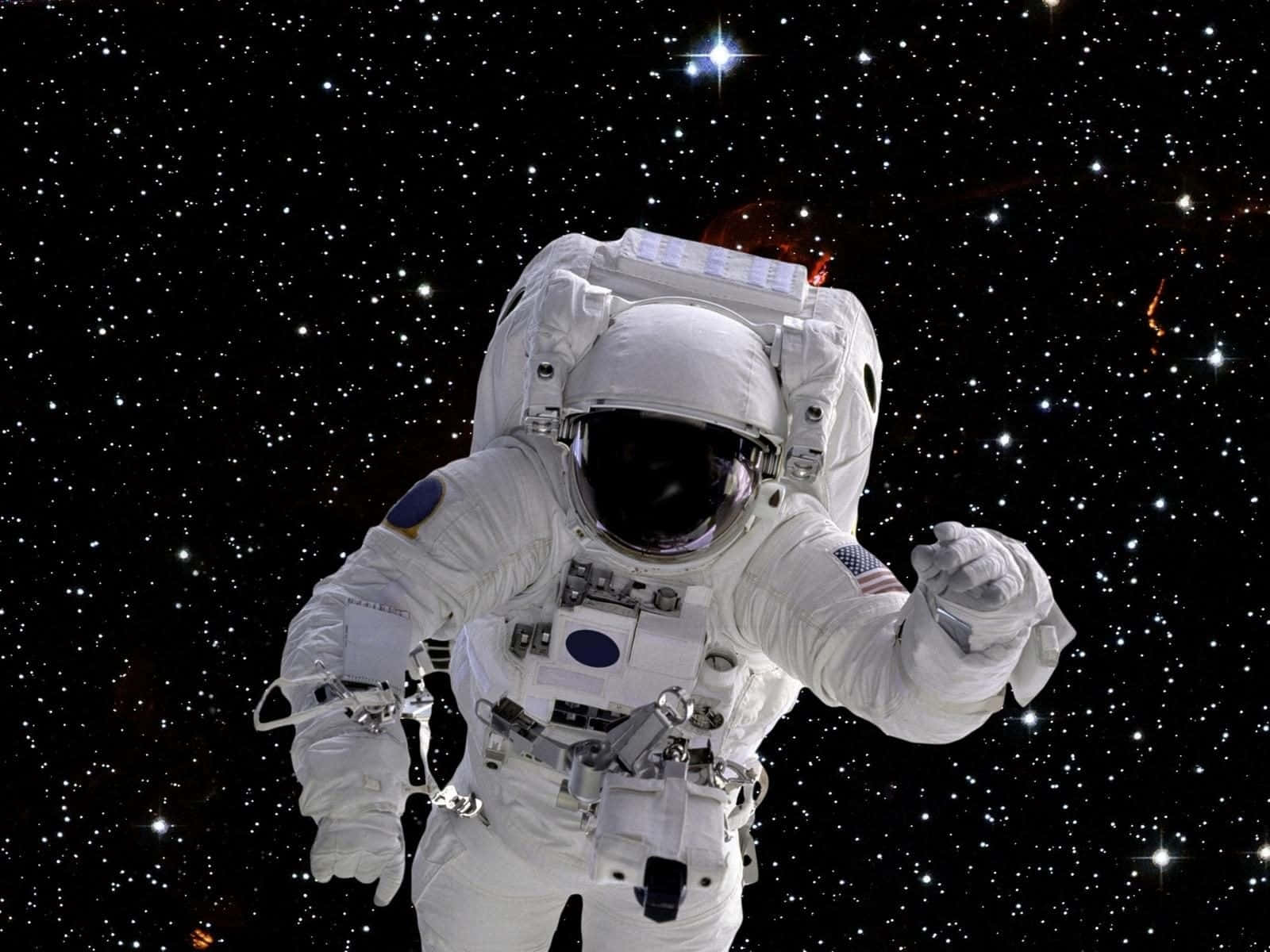 仙女座星系的美麗影像 壁紙 — 一名穿著白色太空衣的太空人，在星光熠熠的宇宙背景下漂浮，周圍有發光的星雲。