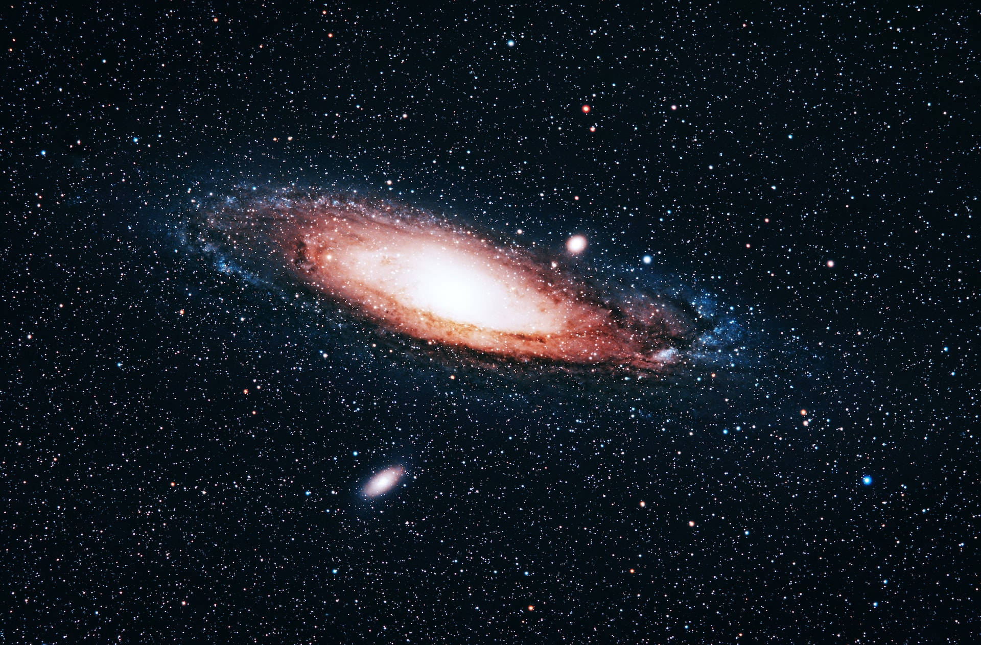 一個在深空中帶有發光旋臂和散落恆星的螺旋星系。