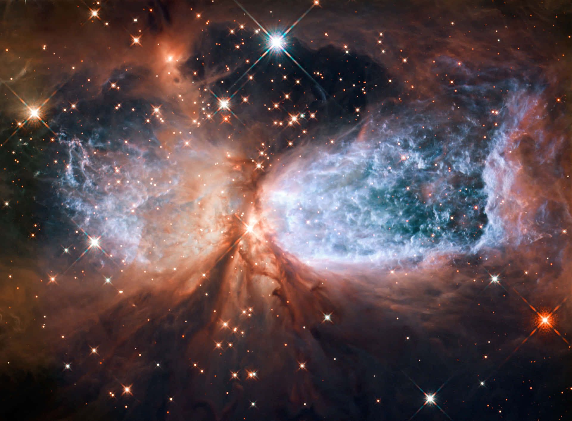 一個色彩繽紛的星雲，充滿了發光的氣體和深空中明亮的星星。