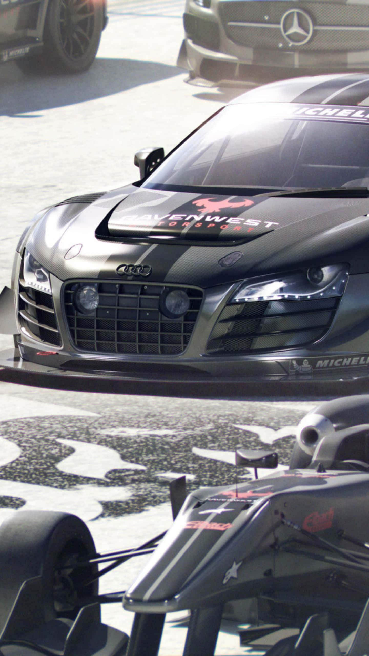 以 Android Grid Autosport 將賽車體驗提升至新境界 壁紙 — 一輛時尚的黑色奧迪R8賽車帶有紅色點綴，在賽道上佔據主導地位，其激進的設計和贊助商貼紙引人注目。