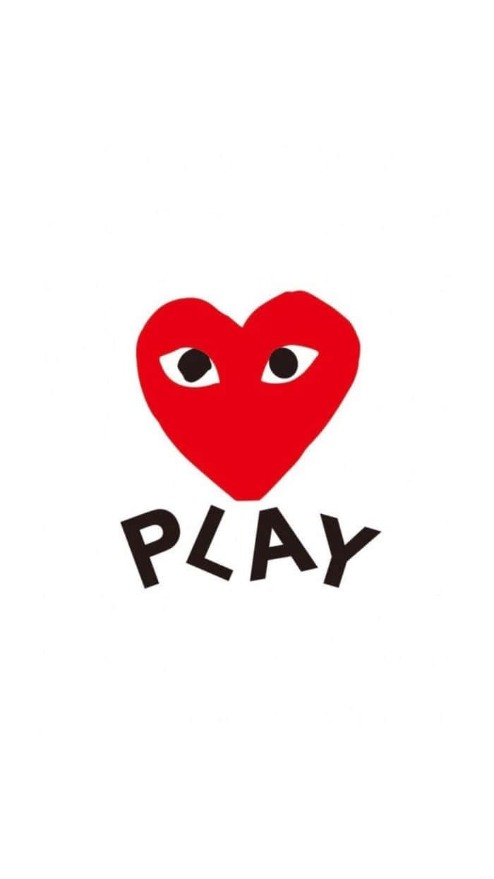 帶有眼睛和黑色字母PLAY的紅色心形。