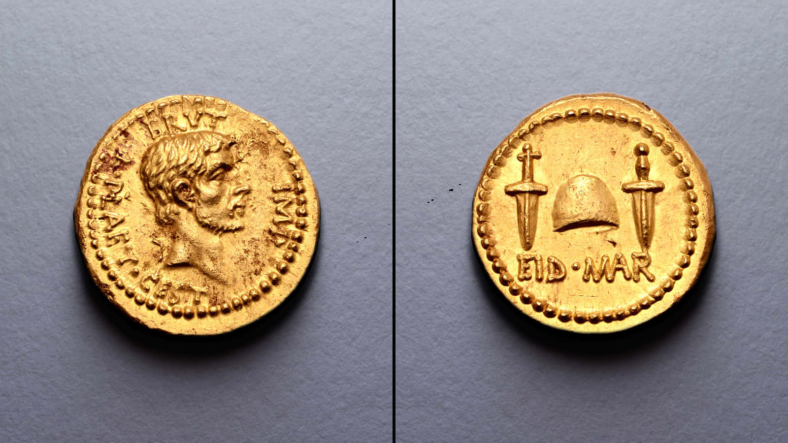 古代羅馬金幣，顯示皇帝側面輪廓和軍事符號。