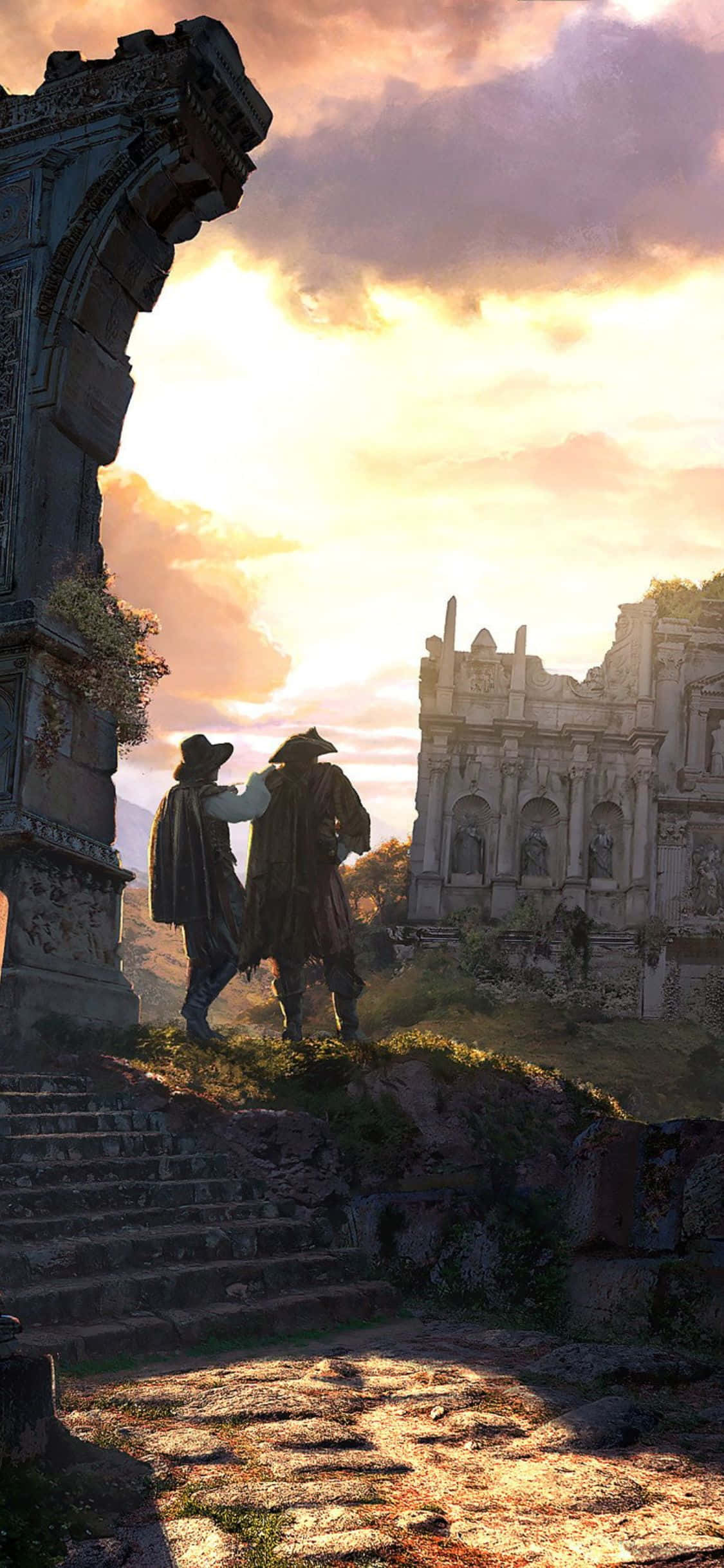 以 iPhone X 沉浸於《Greedfall》世界 壁紙 — 兩個身穿連帽斗篷的身影站在古老石廢墟上，沐浴在金黃色的日落光芒中。