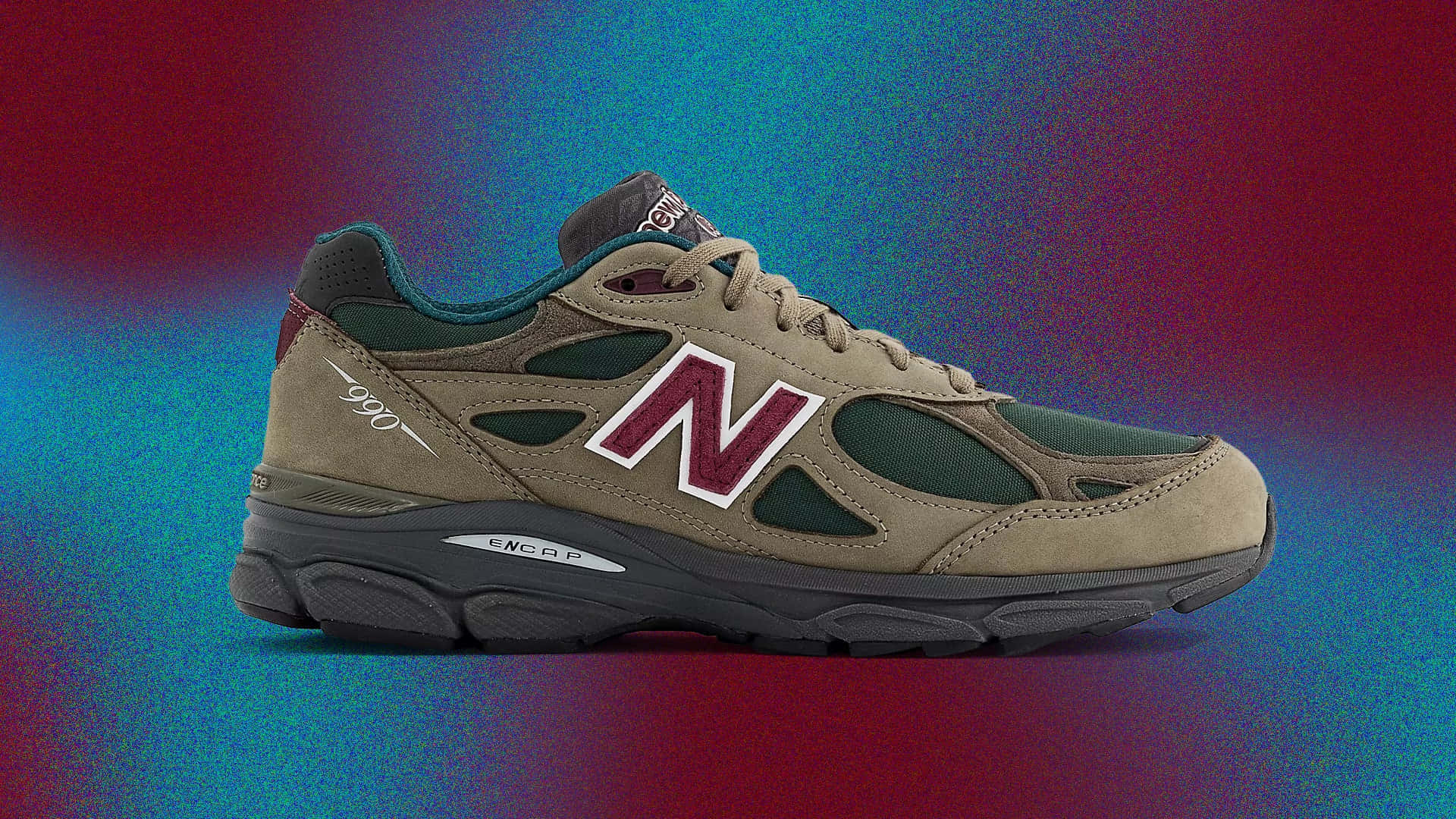 米色New Balance 990運動鞋，帶有栗色標誌，在彩色漸變背景上。