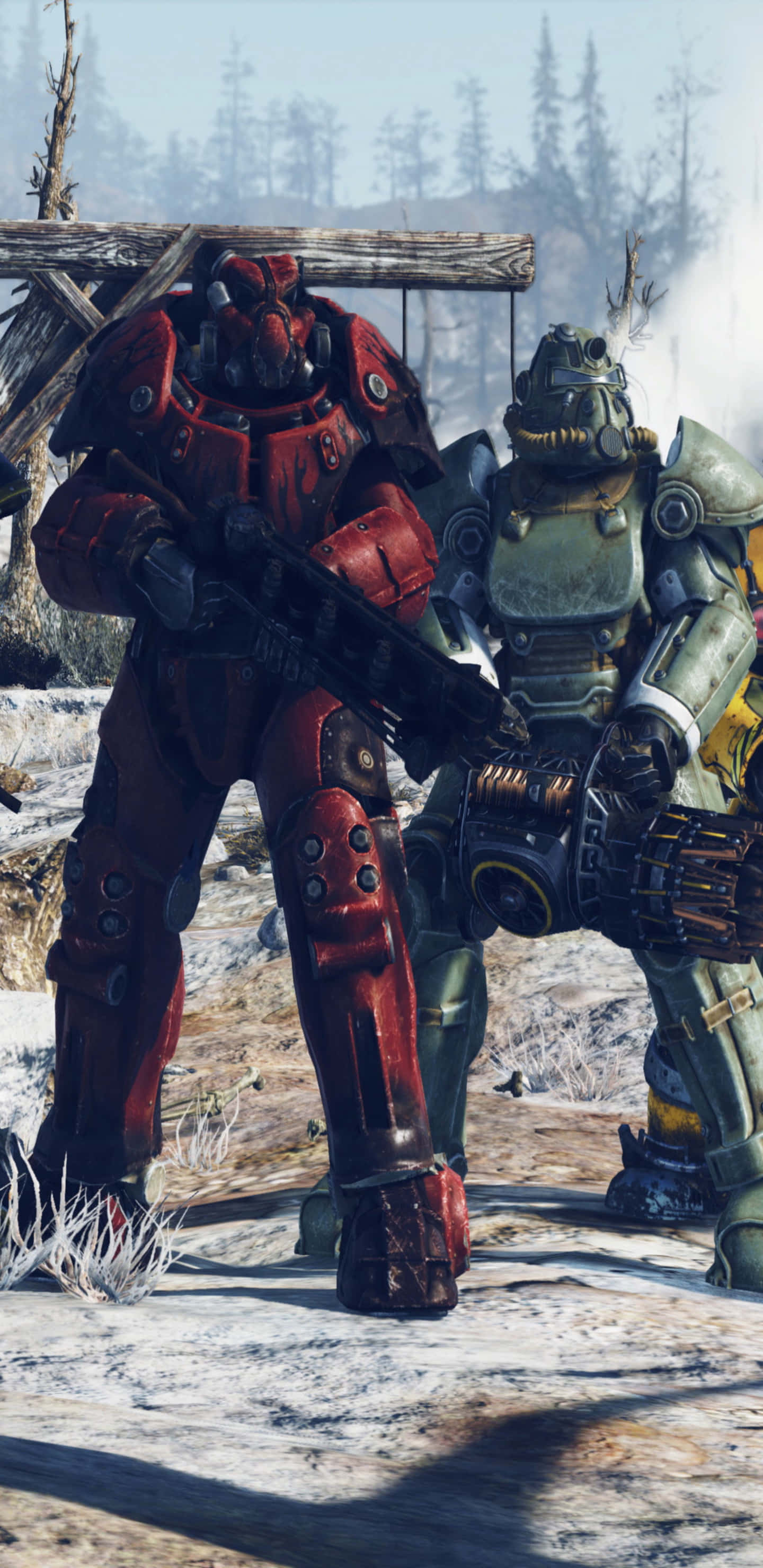 以 Pixel 3XL 和 Fallout 76，擁抱難忘冒險 壁紙 — 兩名重裝動力裝甲士兵站在雪地荒原中，背景有松樹和木結構。