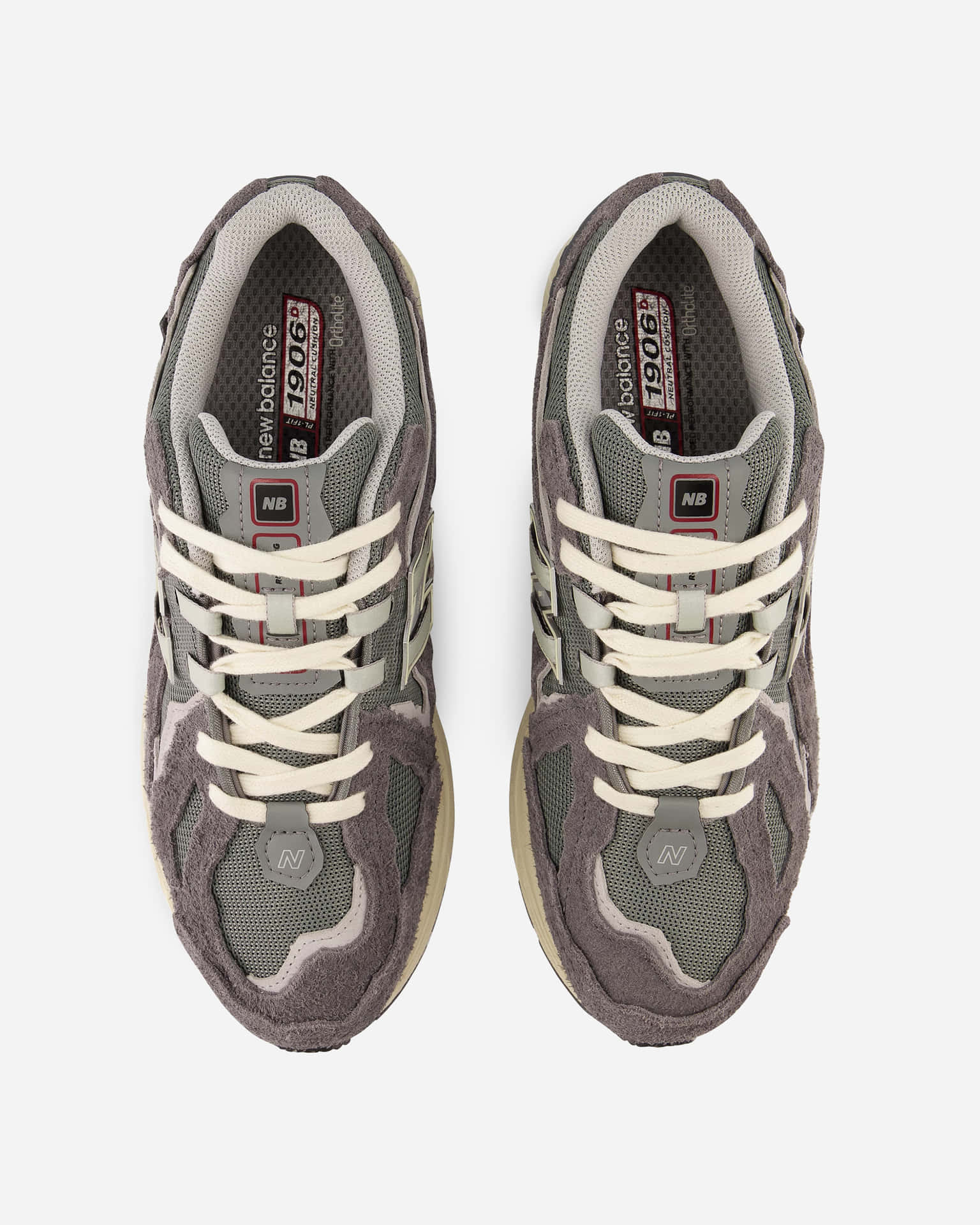 灰色 New Balance 1906S 運動鞋，配有白色鞋帶和米色鞋底，從上方展示。