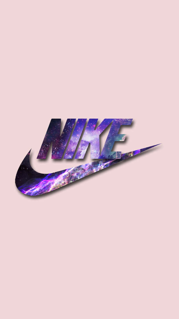 粉紅色背景上帶有銀河圖案的Nike標誌