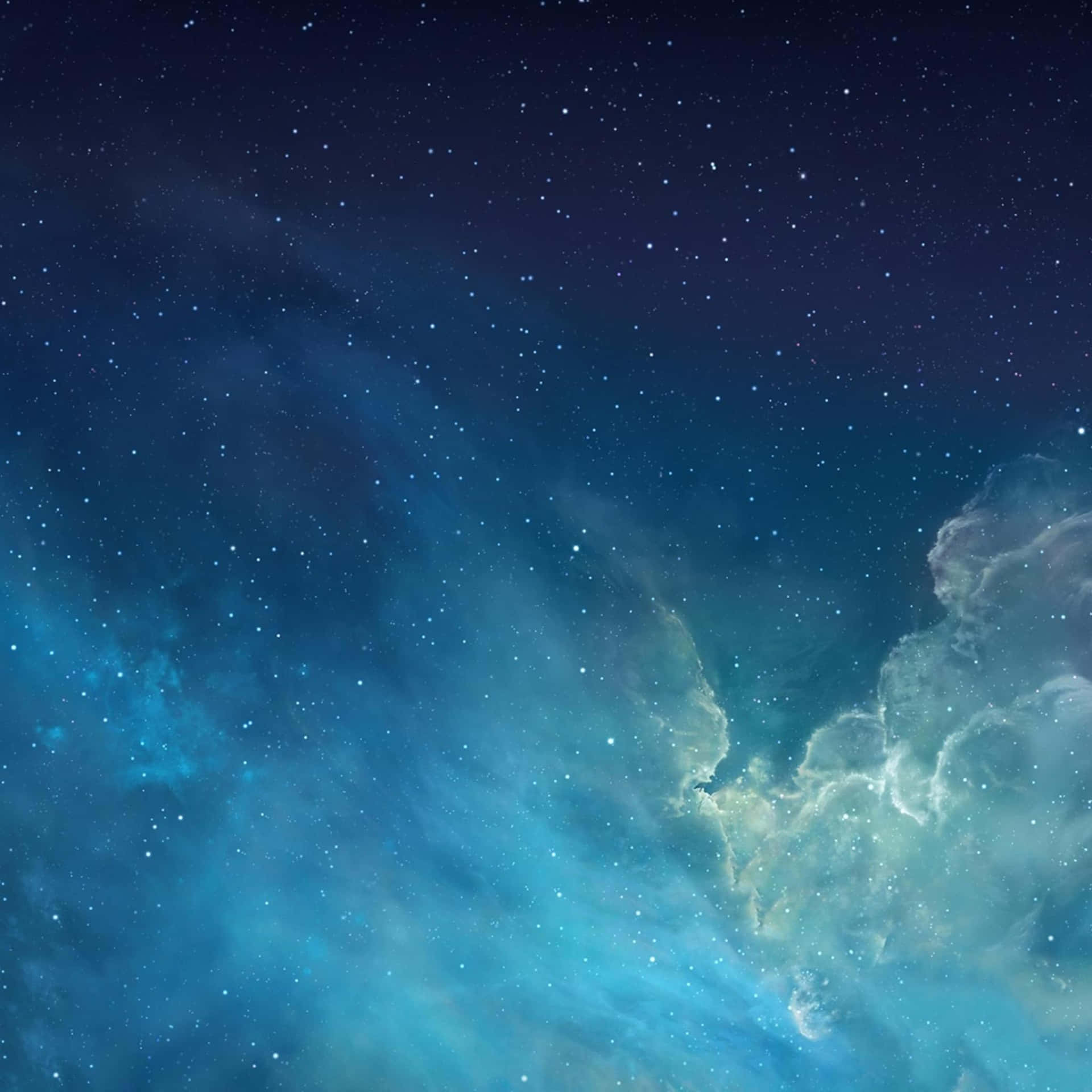 在深空星場下發光的鮮豔藍色和青色星雲。