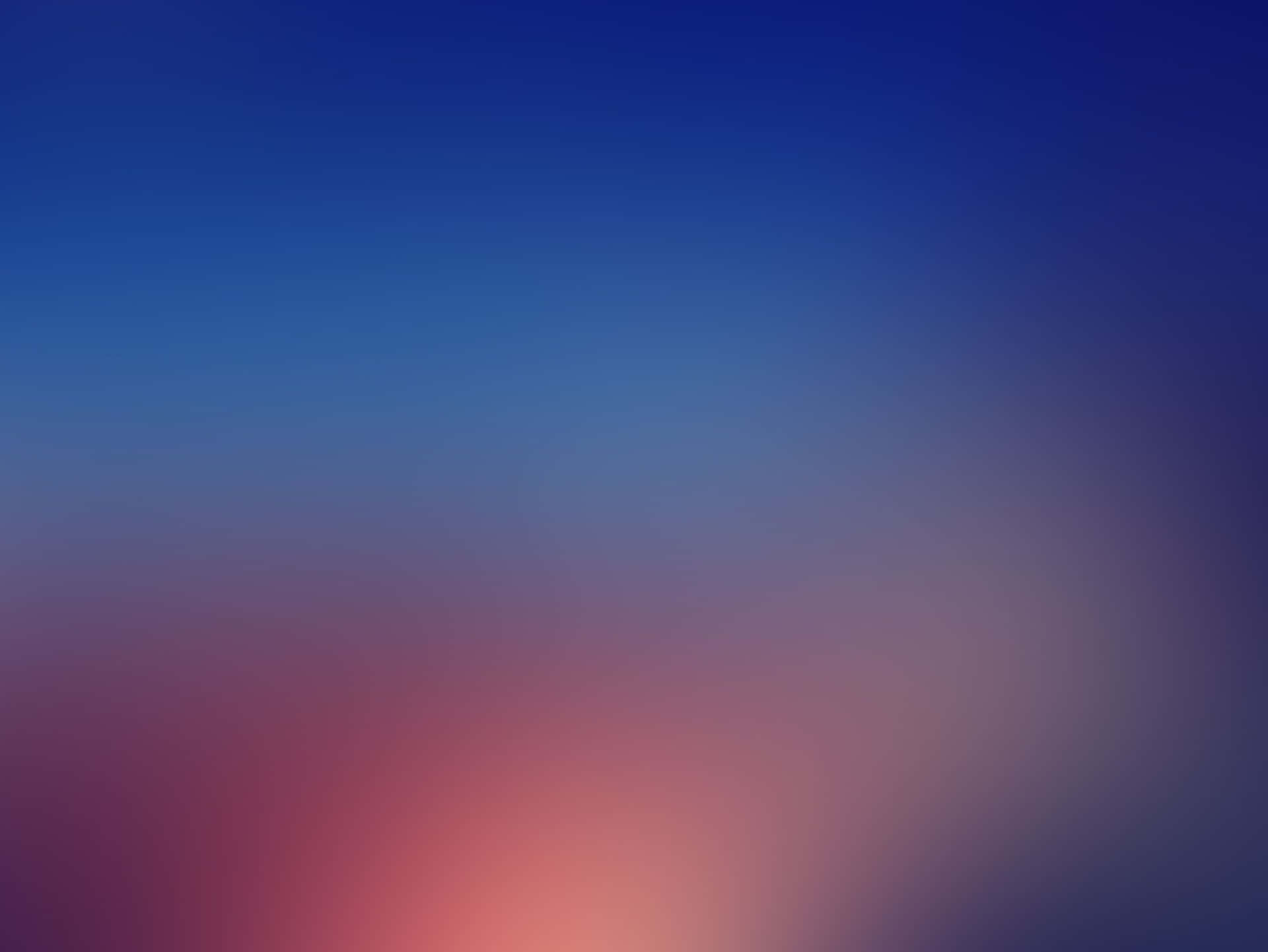 日落時分柔和漸變的天空，融合了藍色和粉紅色色調。