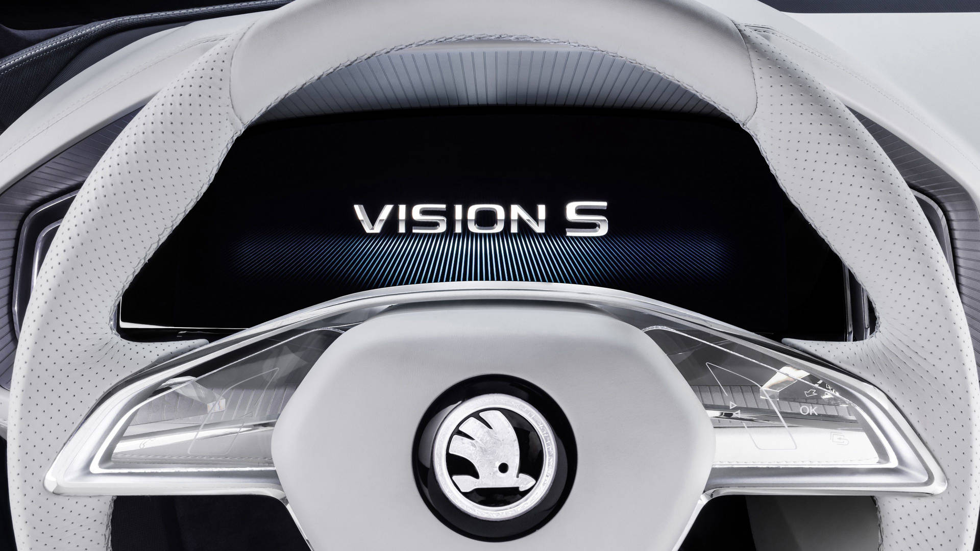 未來感汽車軚盤特寫，帶有 Vision S 顯示屏。