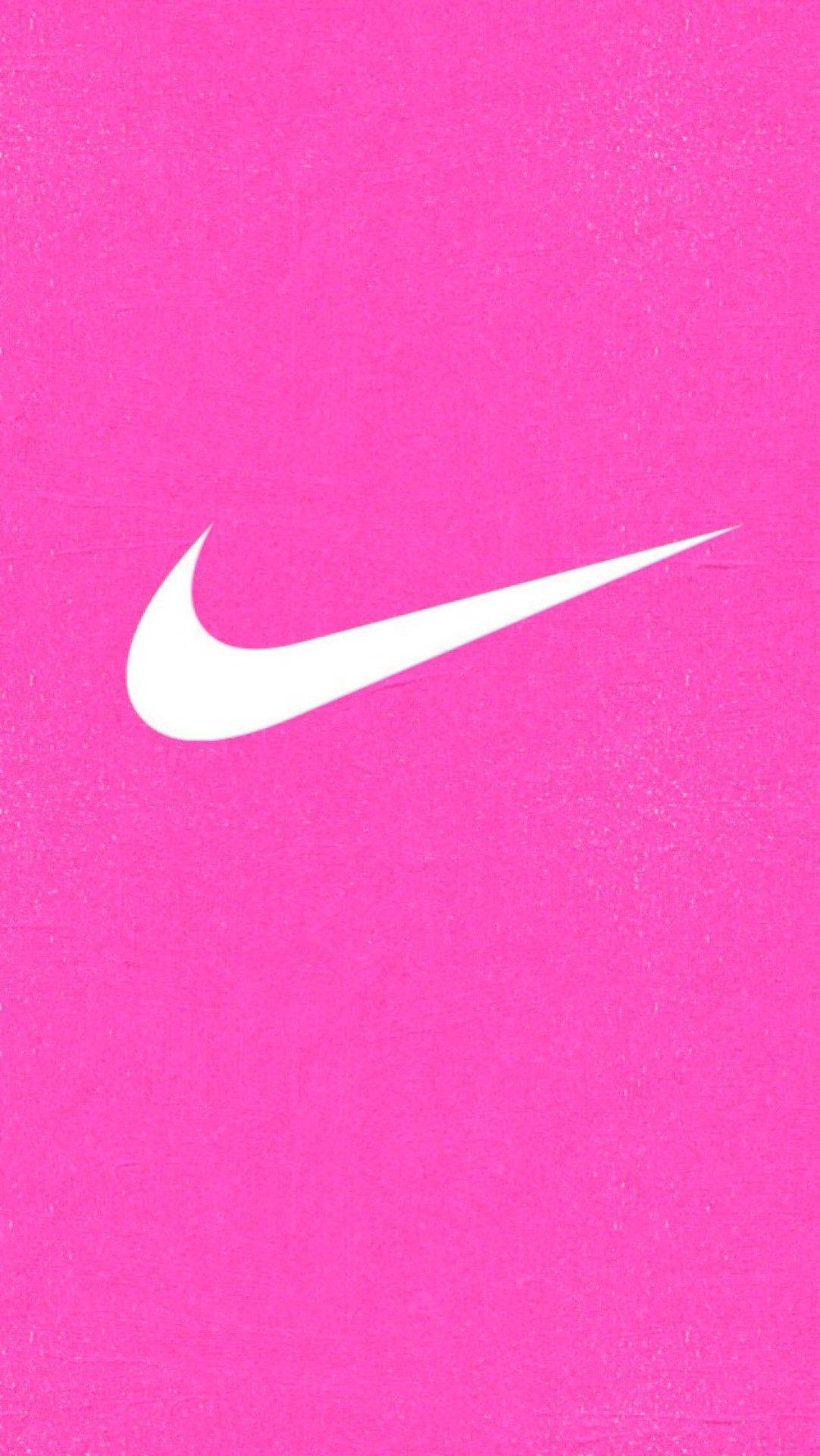白色Nike swoosh標誌在紋理粉紅色背景上。