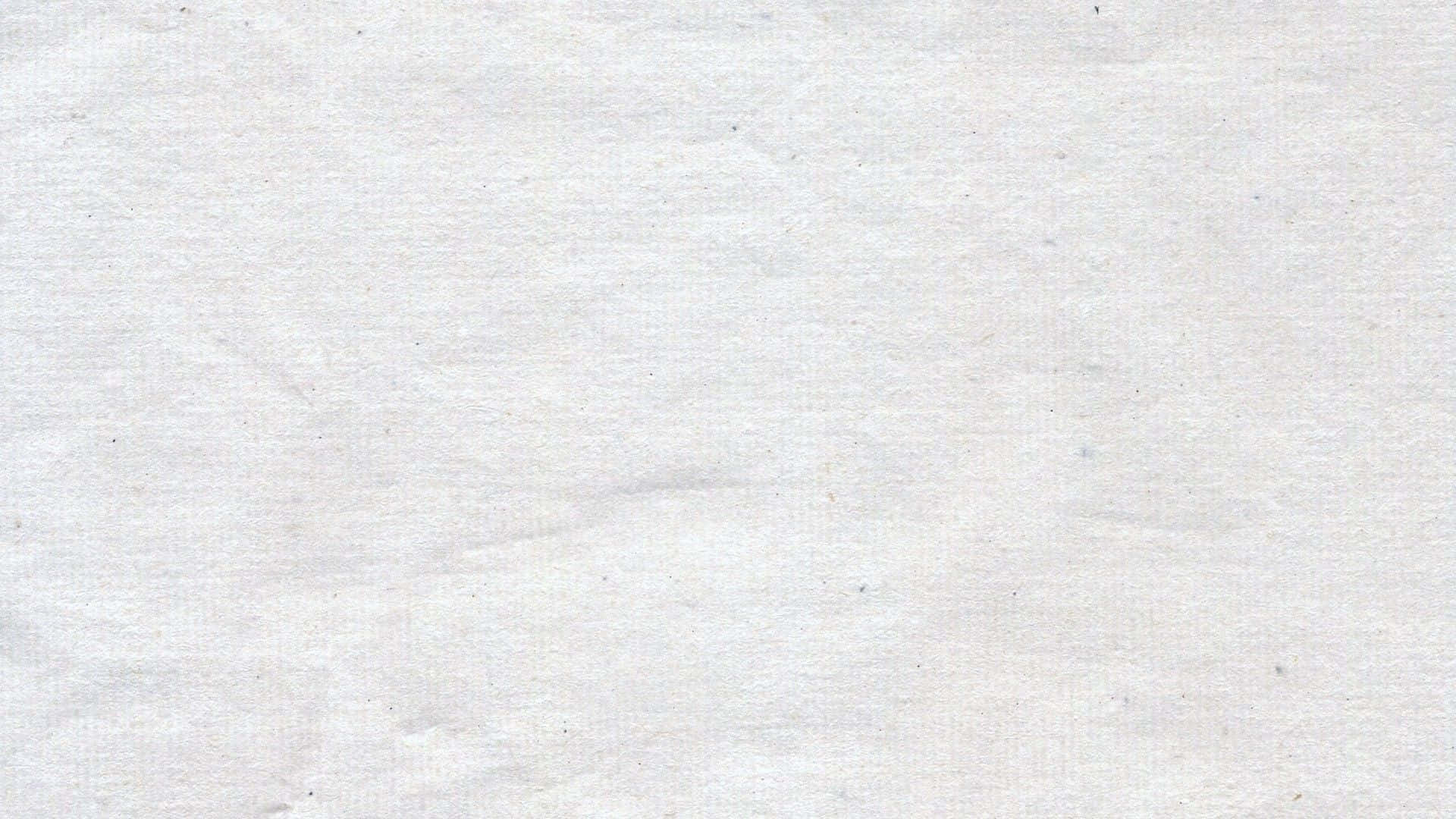 紋理白紙的特寫，帶有柔和摺痕和淡淡斑點。