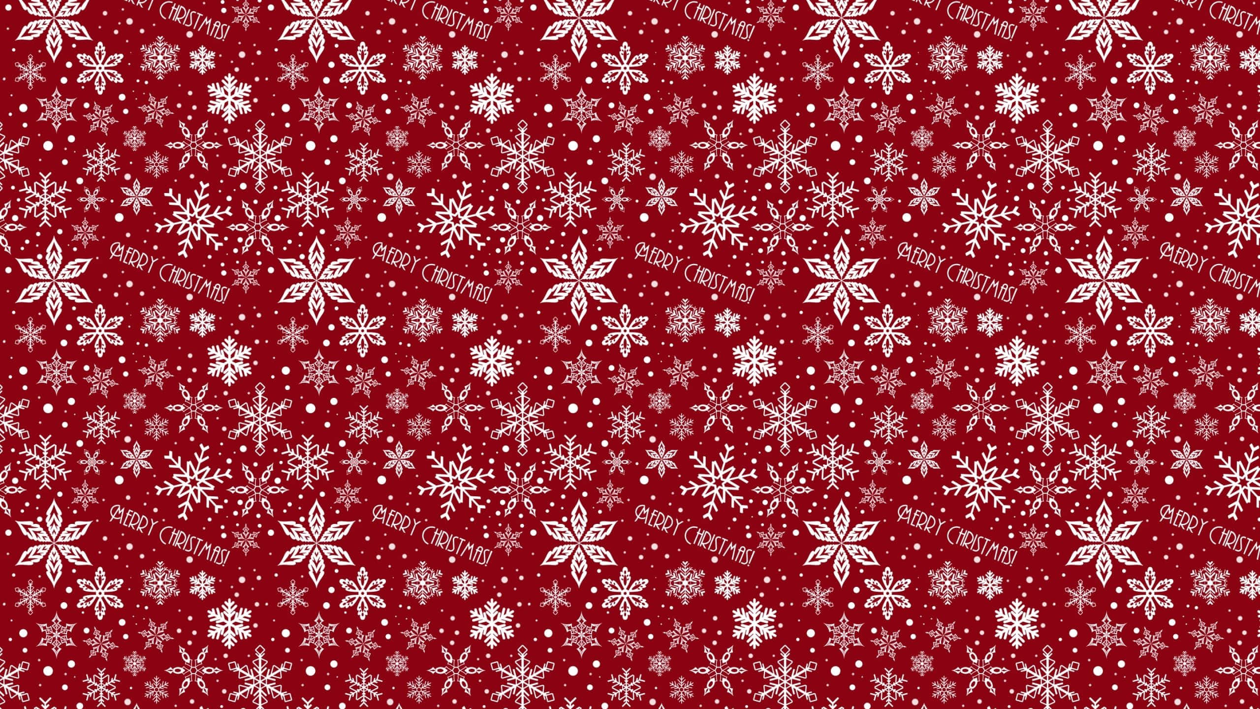 以簡約iPad慶祝聖誕節 壁紙 — 節日紅色牆紙，帶有白色雪花和散落的「MERRY CHRISTMAS」文字。