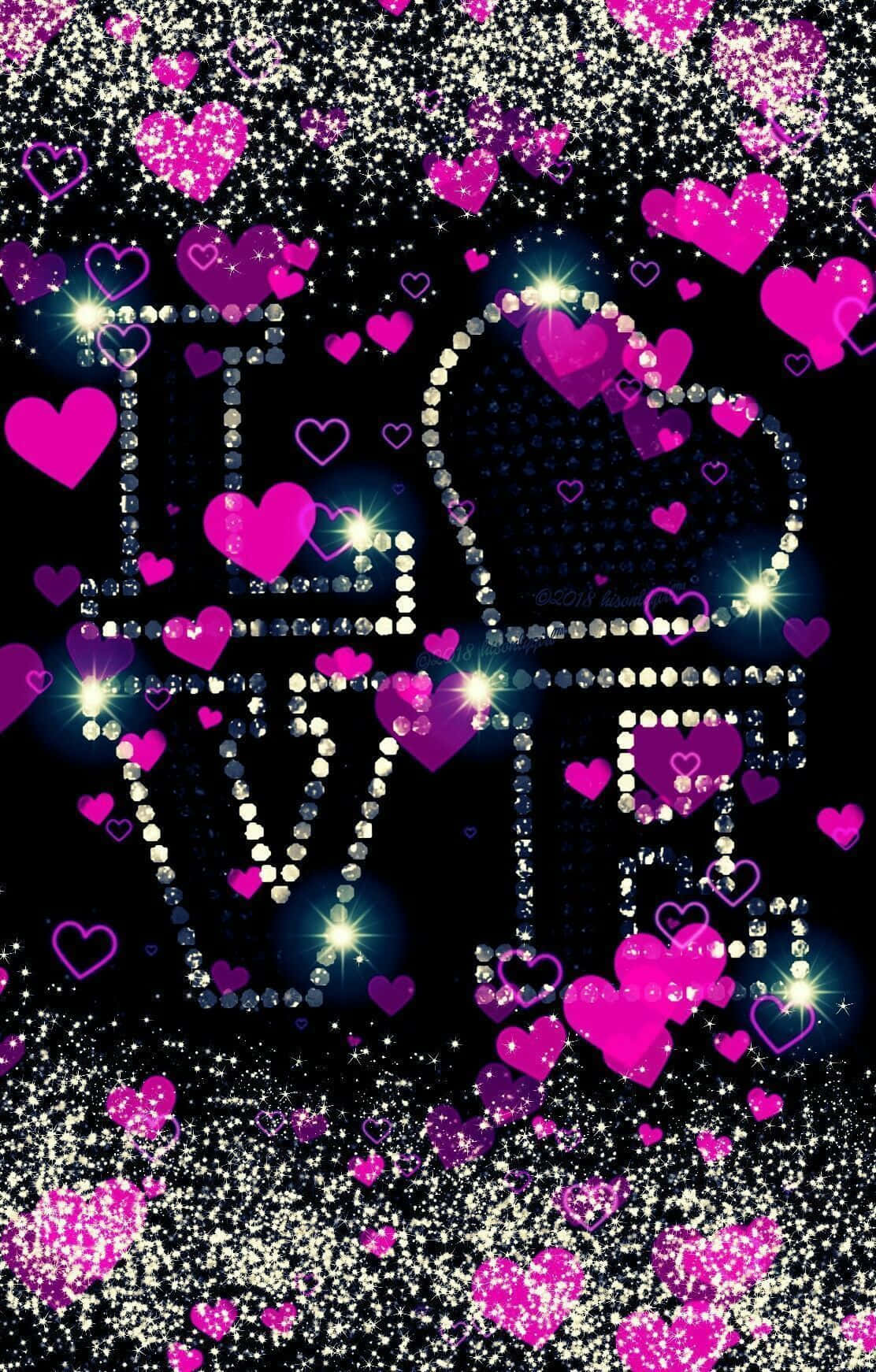 用鑽石勾勒出的love字樣，周圍環繞著粉紅色心形和閃粉。