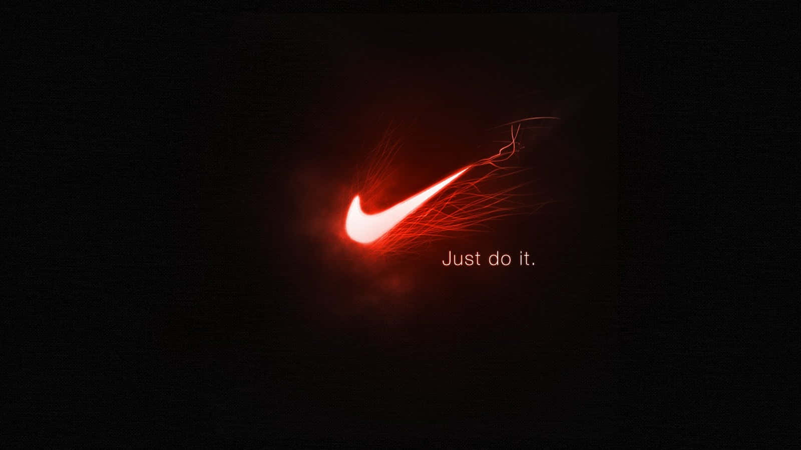 以紅色Nike運動鞋展現大膽優雅 壁紙 — 一個發光的紅色Nike勾號帶有火焰軌跡，在黑色背景上與文字「Just do it.」一同閃耀。