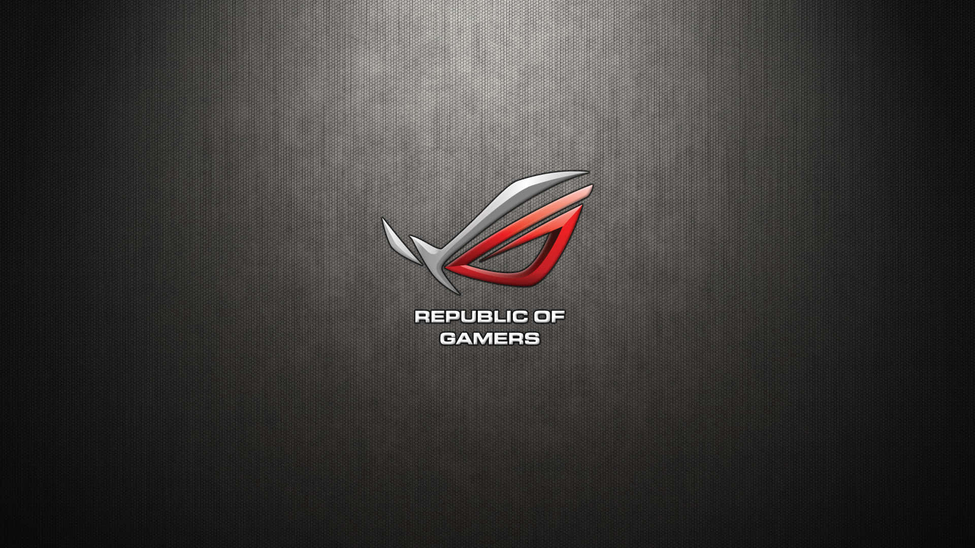 Republic of Gamers 標誌在深色紋理金屬背景上，帶有聚光燈效果。