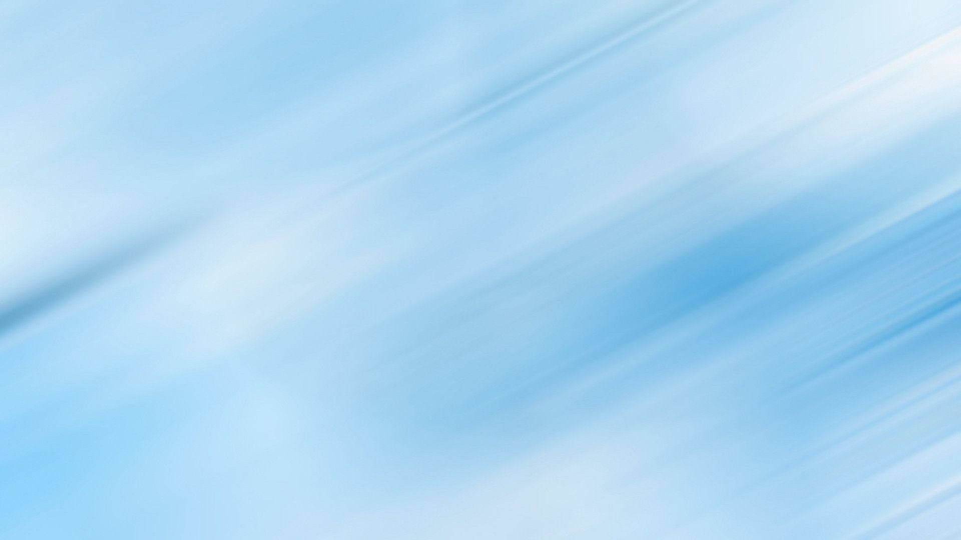 帶有對角線運動模糊條紋的柔和藍白抽象背景。