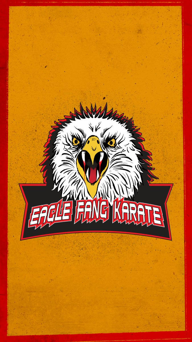 Eagle Fang Karate 標誌，特色是帶有鋒利牙齒的兇猛鷹頭和粗體紅色文字。